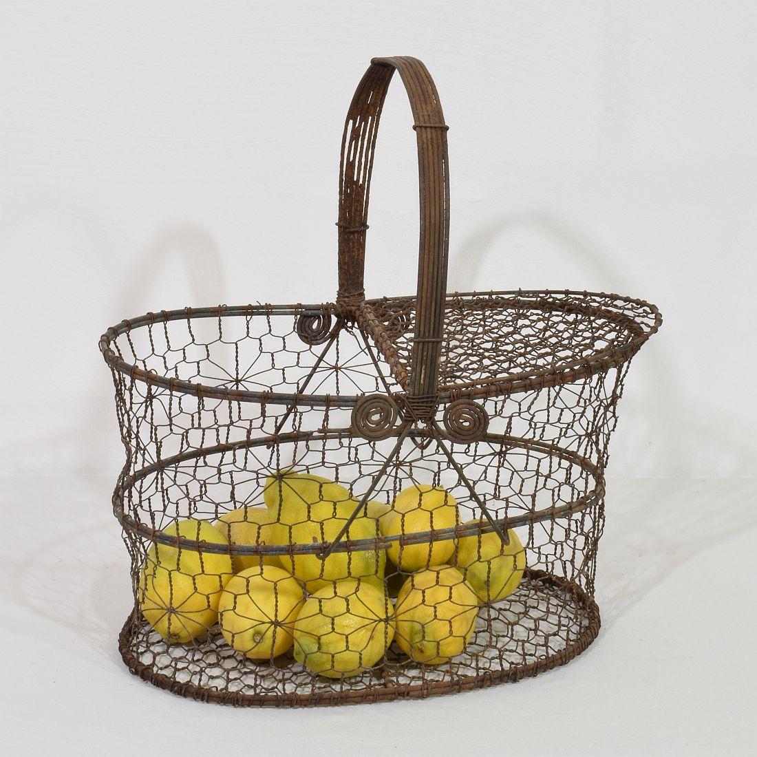 Beautiful iron wirework basket with a great form. Very nicely made and a great statement on your countertop.
France, circa 1850-1900.
Weathered.