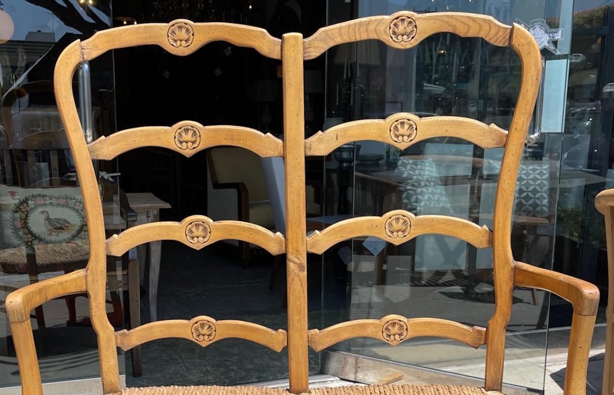 French 19th Century Ladder-back Banquette with Arms and Rush Seat In Distressed Condition For Sale In Santa Monica, CA