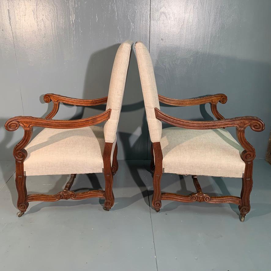 Lovely quality pair of large French 19th century oak armchairs or fireside chairs.
Very decorative carved frames and they have been fully restored.
The frames are solid, comfortable and with new upholstery and finished with antiqued studs and a