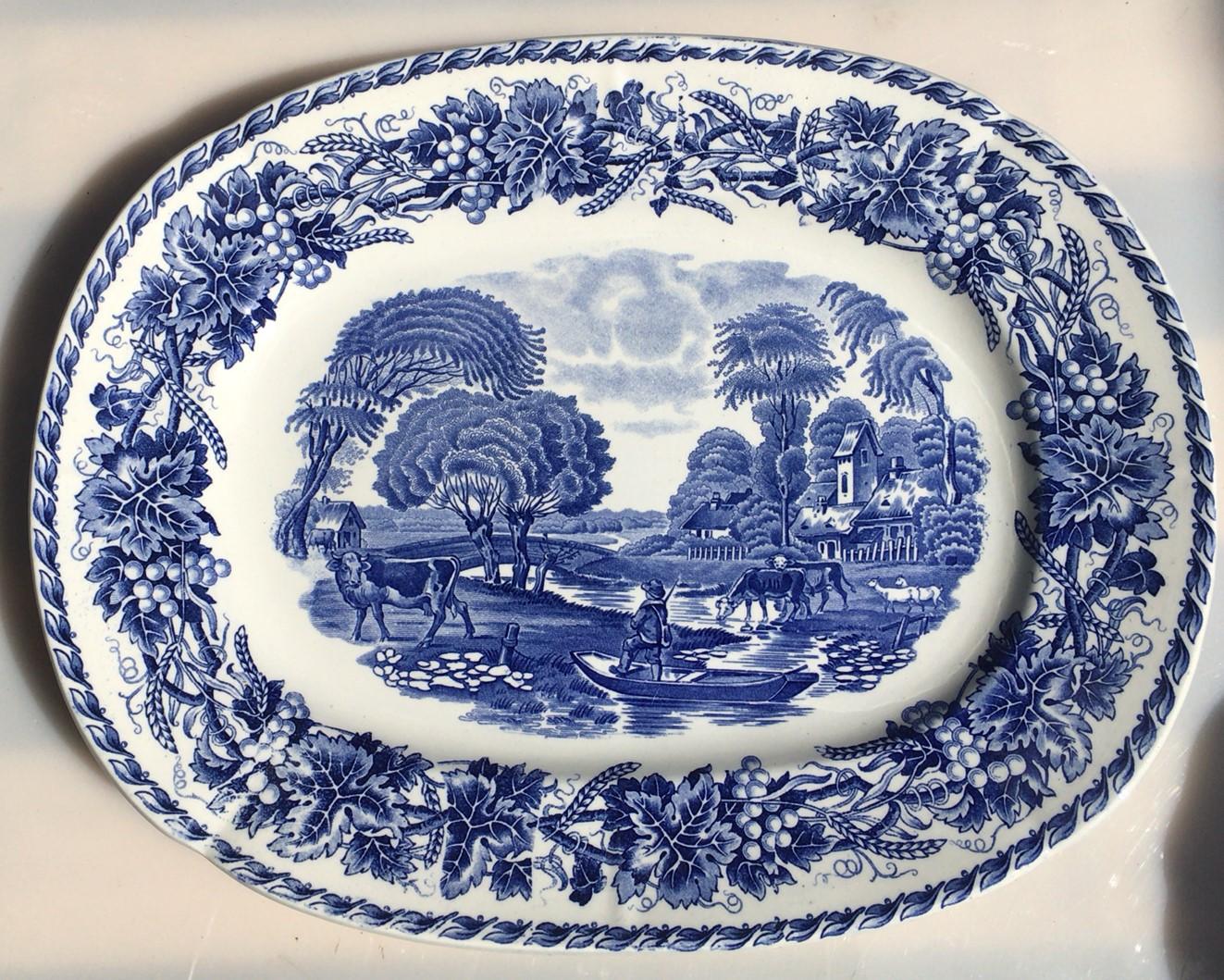 19th century large blue and white French transferware platter signed Utzschneider & Cie (Sarreguemines)
Model Helvetia.
Scene with fisherman, cows, trees and river.
Border with grapes and wheat.
Measures: 15