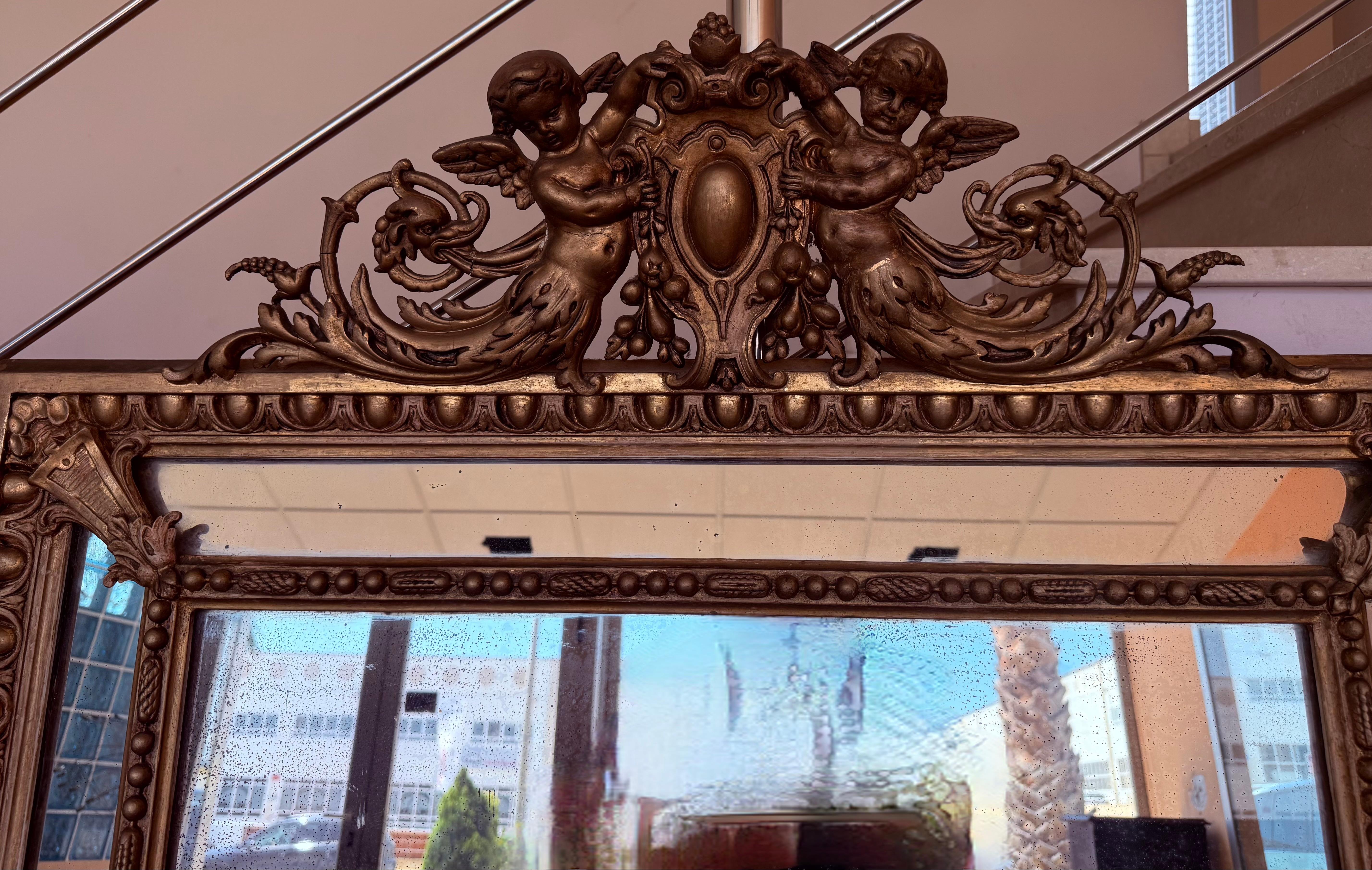 Giltwood French 19th Century Large Vertical Gold Gilt Mirror with Cherub crest For Sale