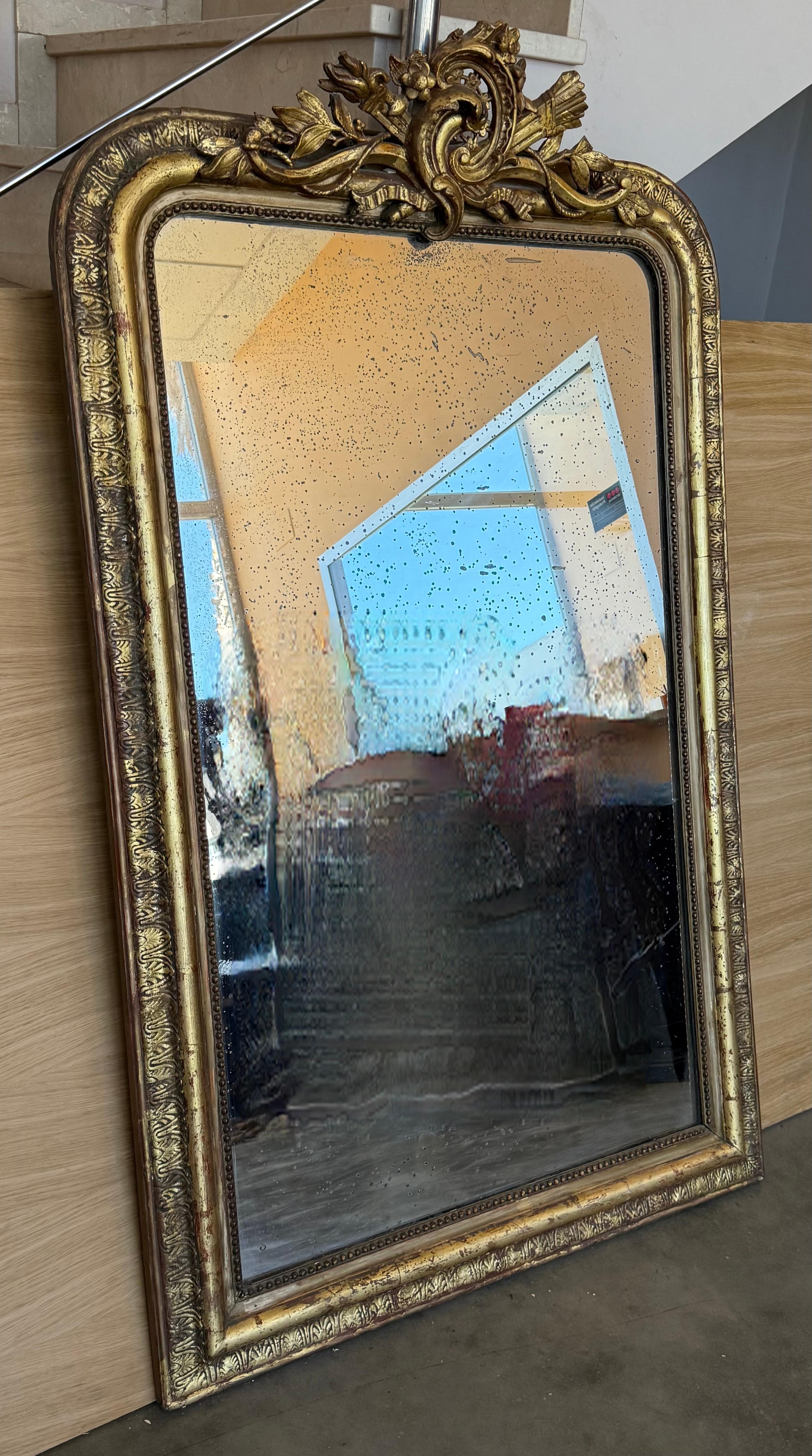 French Provincial French 19th Century Large Vertical Gold Gilt Mirror with Floral crest For Sale