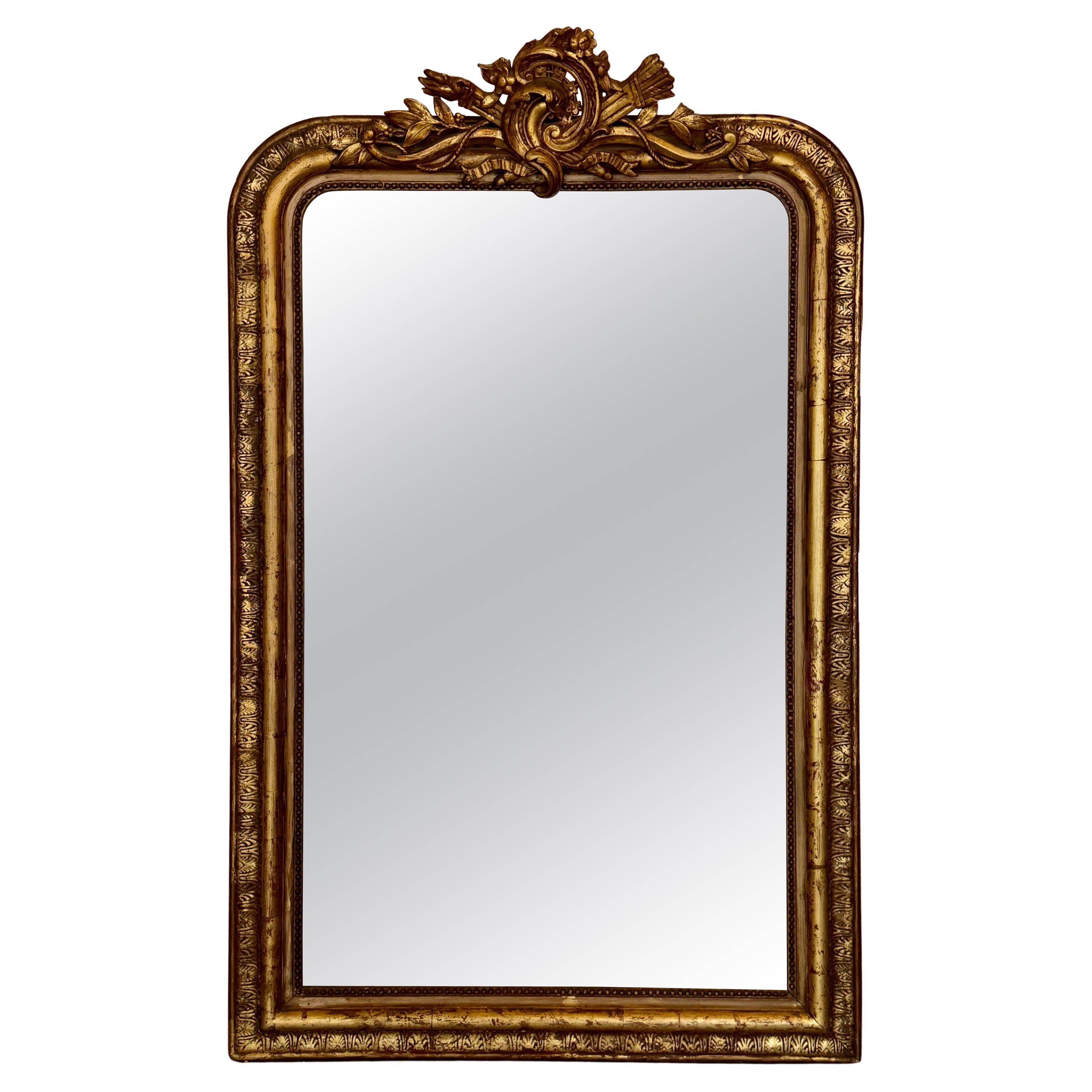French 19th Century Large Vertical Gold Gilt Mirror with Floral crest For Sale