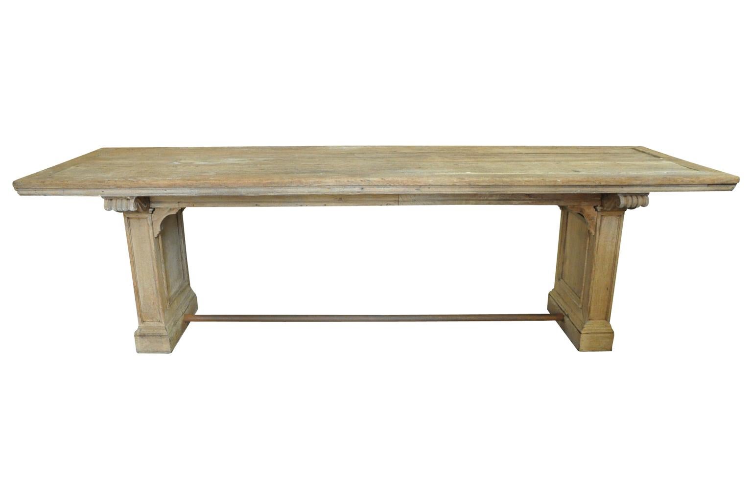 A very lovely 19th century library table - Trestle table from the Provence region of France. Wonderfully constructed from washed oak - very sound. Very handsome scrolling corbels to support the top and wonderful molded paneled legs.