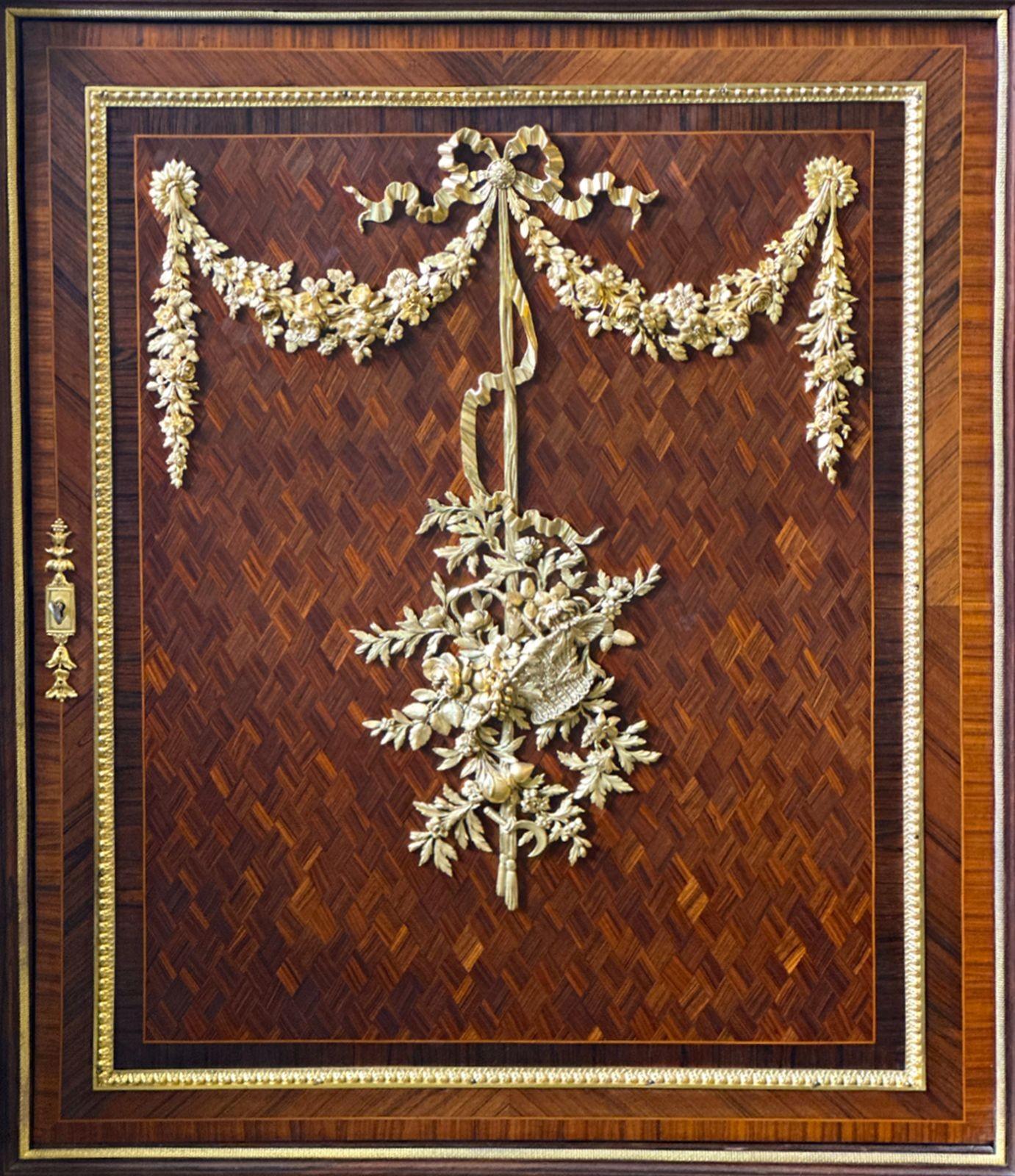 Exceptional Louis XVI Style parlor cabinet with impeccable parquetry. The piece is adorned with quality bronze ormolu mounts all around. The colors on the installed breche marble top blend perfectly with the cabinet. Key included for