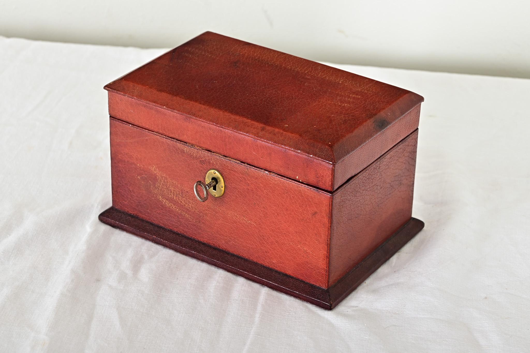 French 19th century red leather box with working lock & key, to make a unique presentation box or keep precious mementos safe. The interior is lined with silk and velvet for a beautiful unboxing experience every time. Please view the detailed