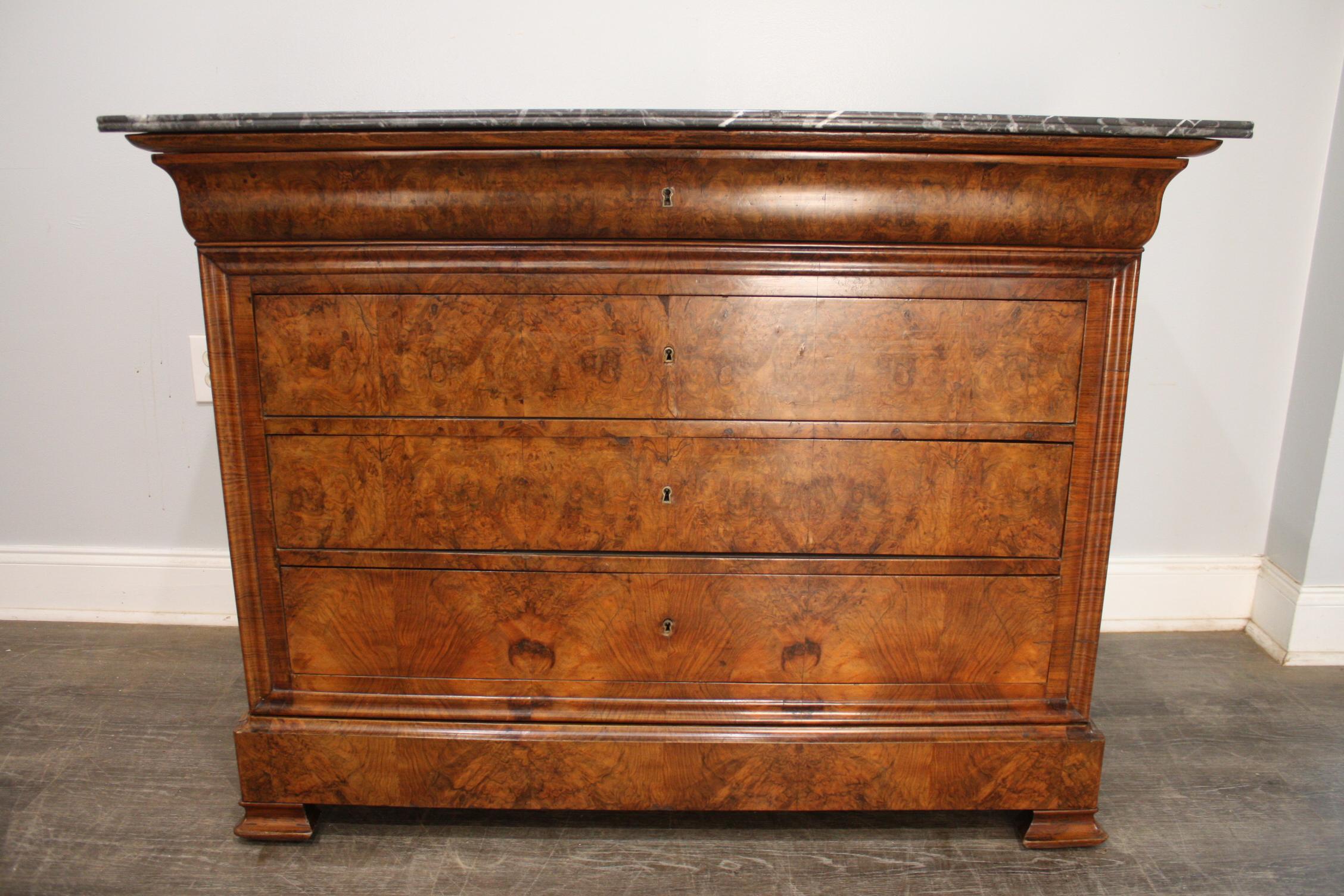This 19th century French Commode is made of burl of walnut with a Sainte-Anne marble top. Simple and elegant.