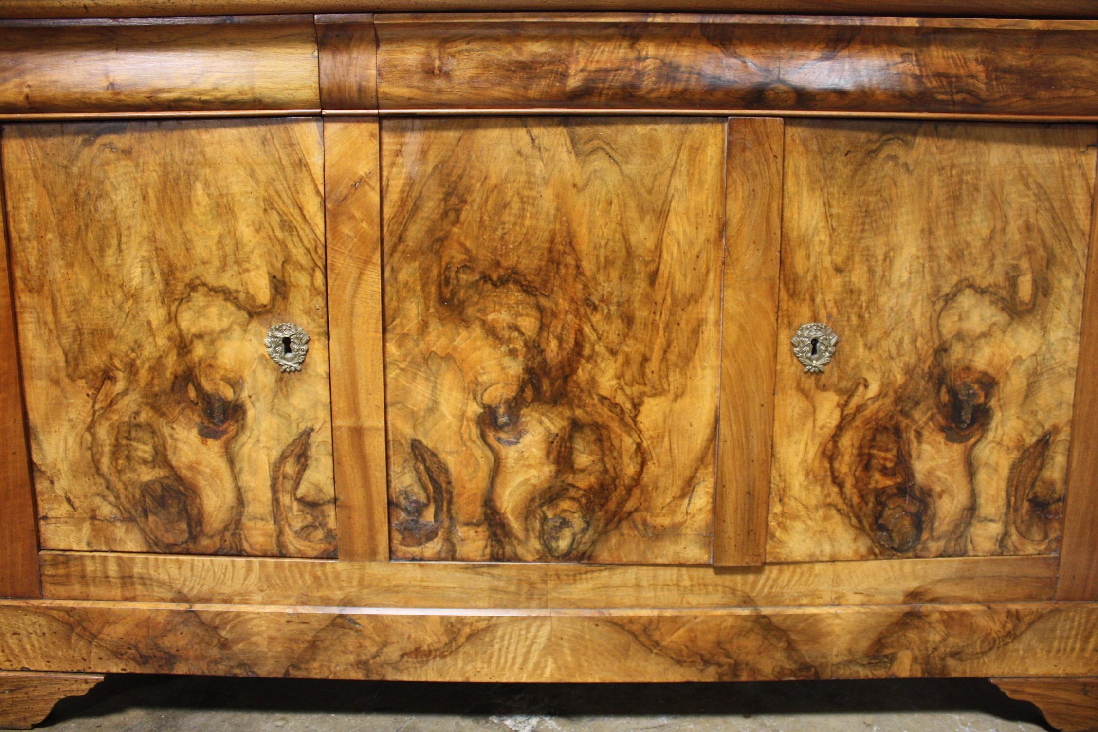 Magnificent French 19th Century Louis Philippe Period Enfilade. It wears an amazing burl and flamed walnut.