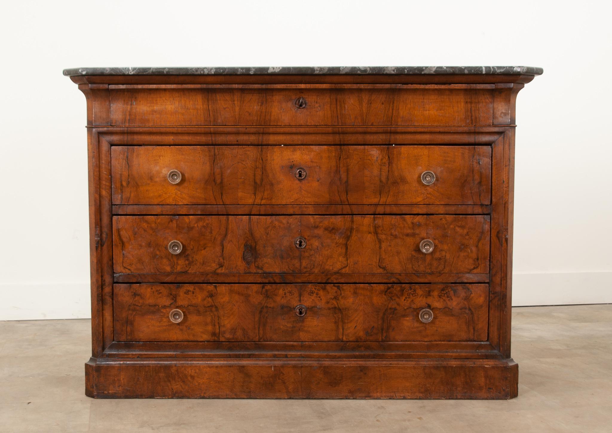 A beautiful 19th century French mahogany Louis Philippe style commode, circa 1840. The original removable marble top is in superb antique condition and has canted corners shaped to match the base. The marble is gorgeous with dramatic charcoal, gray,