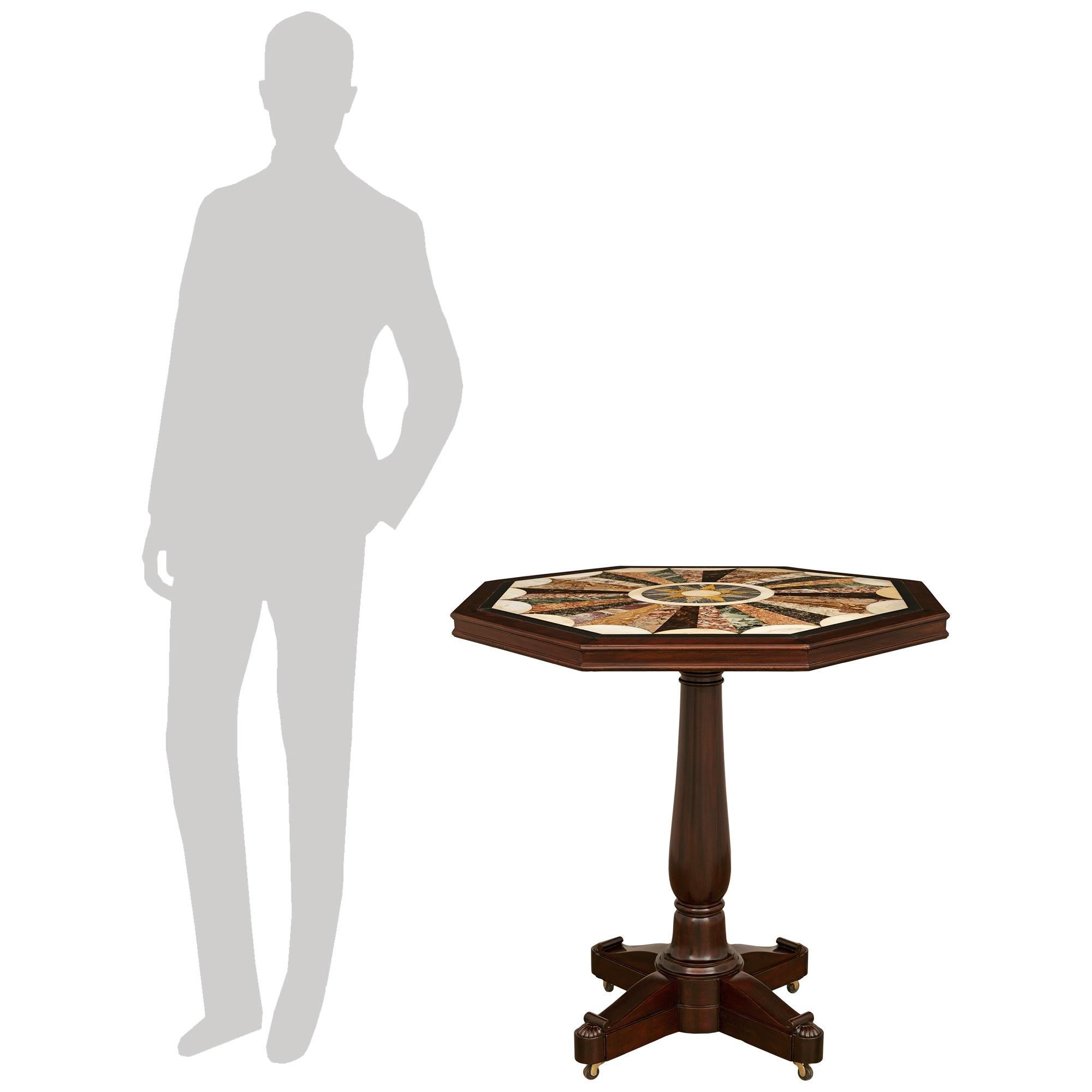 A handsome and high quality French 19th century Louis Philippe Period Mahogany and Specimen Marble side table. This wonderful table is raised on casters below the four feet ending with elegant palmettes. Above is the solid Mahogany turned fut