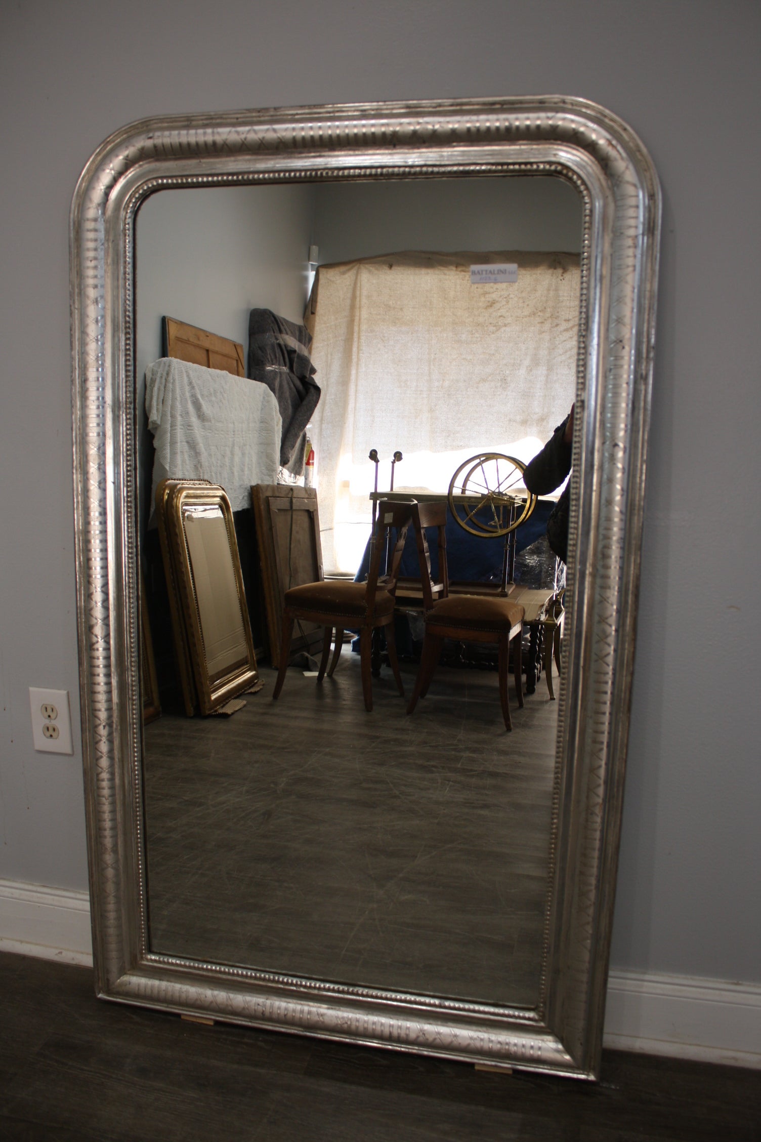 Wonderful mirror covered of silver leaf with pattern design on it.