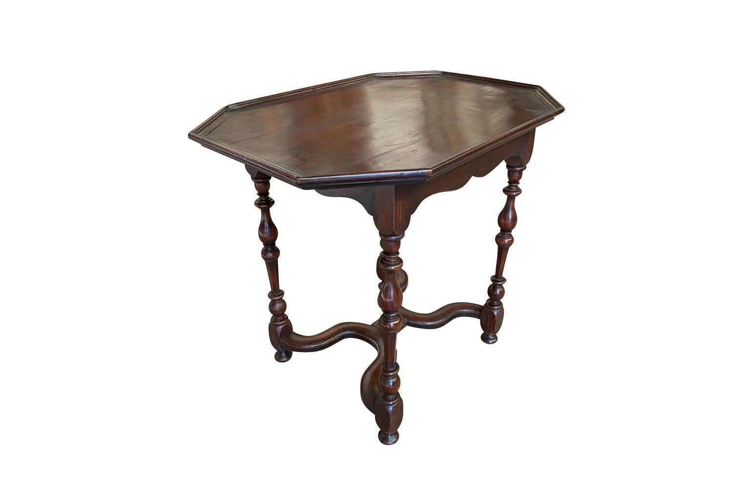 A very lovely French mid-19th century Louis XIII style side table beautifully constructed from walnut with a nice raised edge finish, single drawer and handsome turned legs.