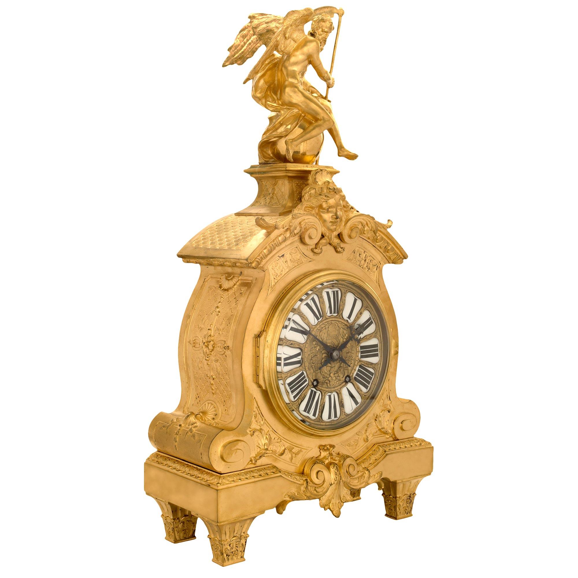 A handsome and high quality mid-19th century French Louis XIV st. ormolu clock. The clock is raised by four tapered fluted legs decorated with acanthus leaves. The scalloped shaped center frieze is with a central reserve of 