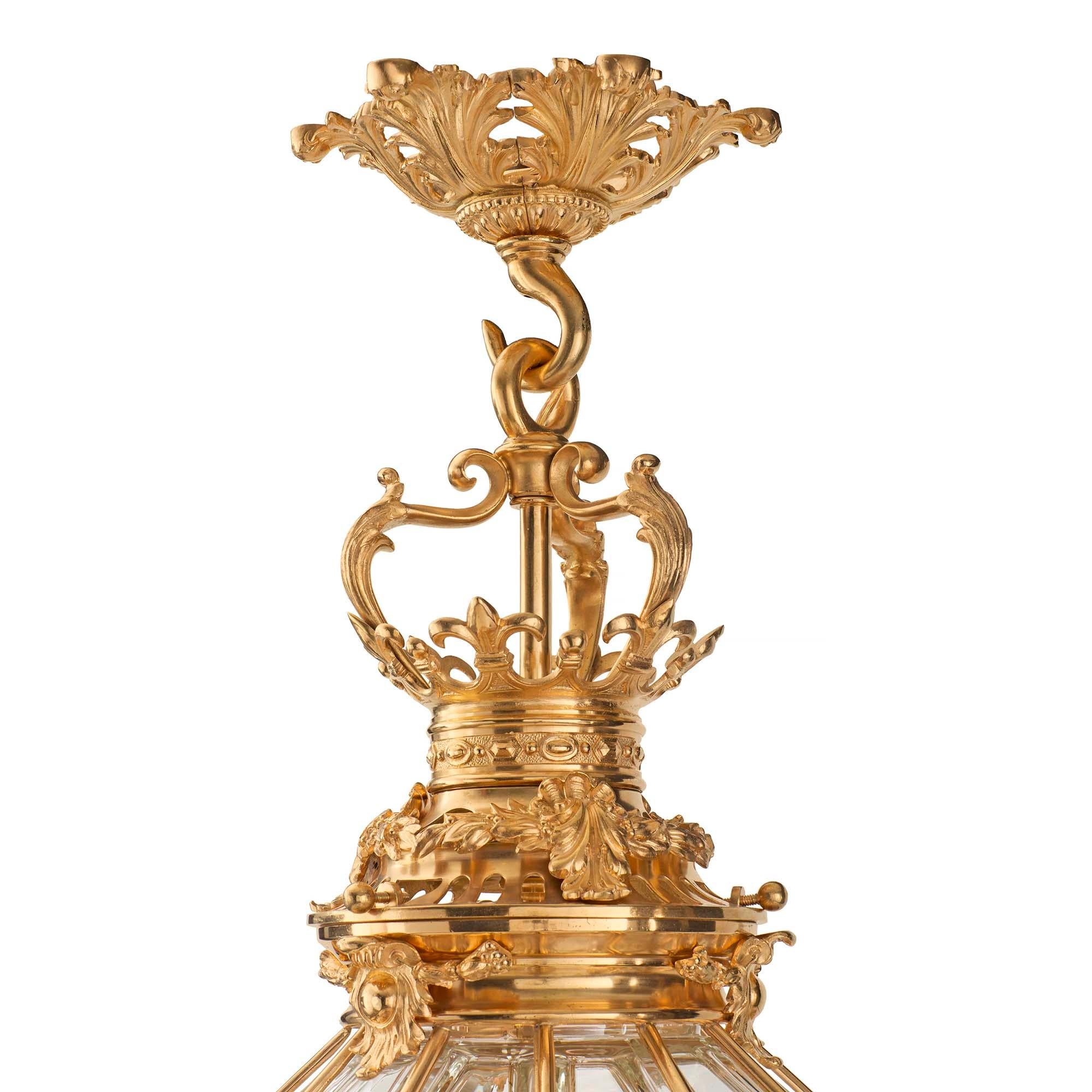 A spectacular and high quality French 19th century Louis XIV st. ormolu and crystal lantern. The lantern is modeled off a lantern still situated in the Palais de Versailles, which was featured in Henry Havard's 19th century Ameublement dictionary