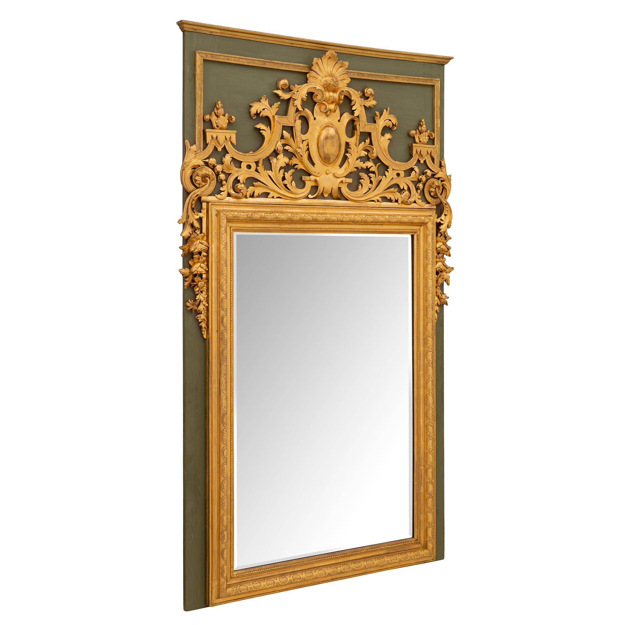 A superb French 19th century Louis XIV st. polychrome and giltwood mirror. The original beveled mirror plate is framed within a most decorative twisted rope designed band and Fine mottled giltwood border with elegant carved geometric patterns.