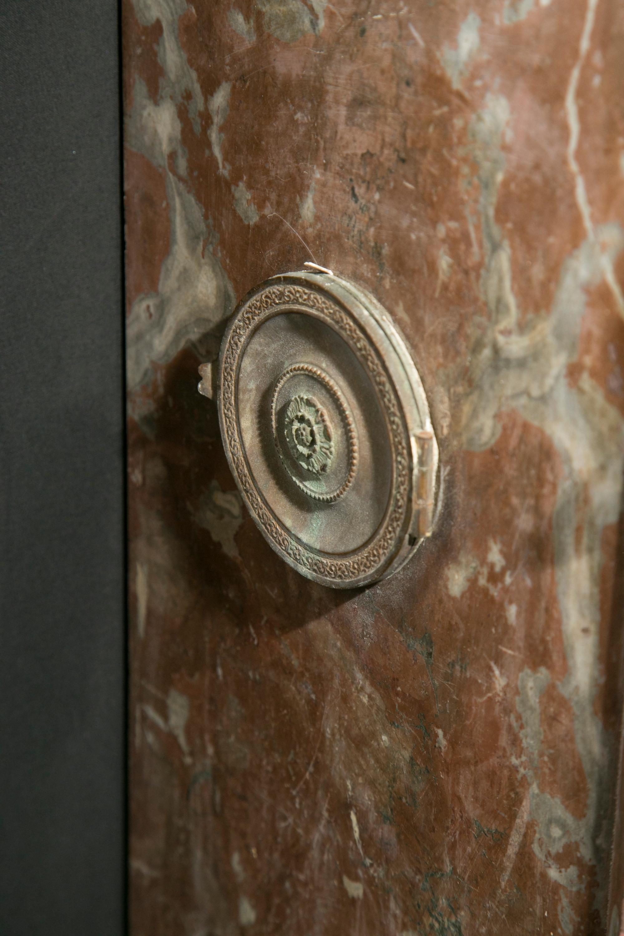 This Louis XV – XVI Transition marble mantel features a contour shelf on a classic Louis XV apron with carved front and sides. The French antique piece dates back to the 19th century and  sports marble with subtle white striations interspersed in