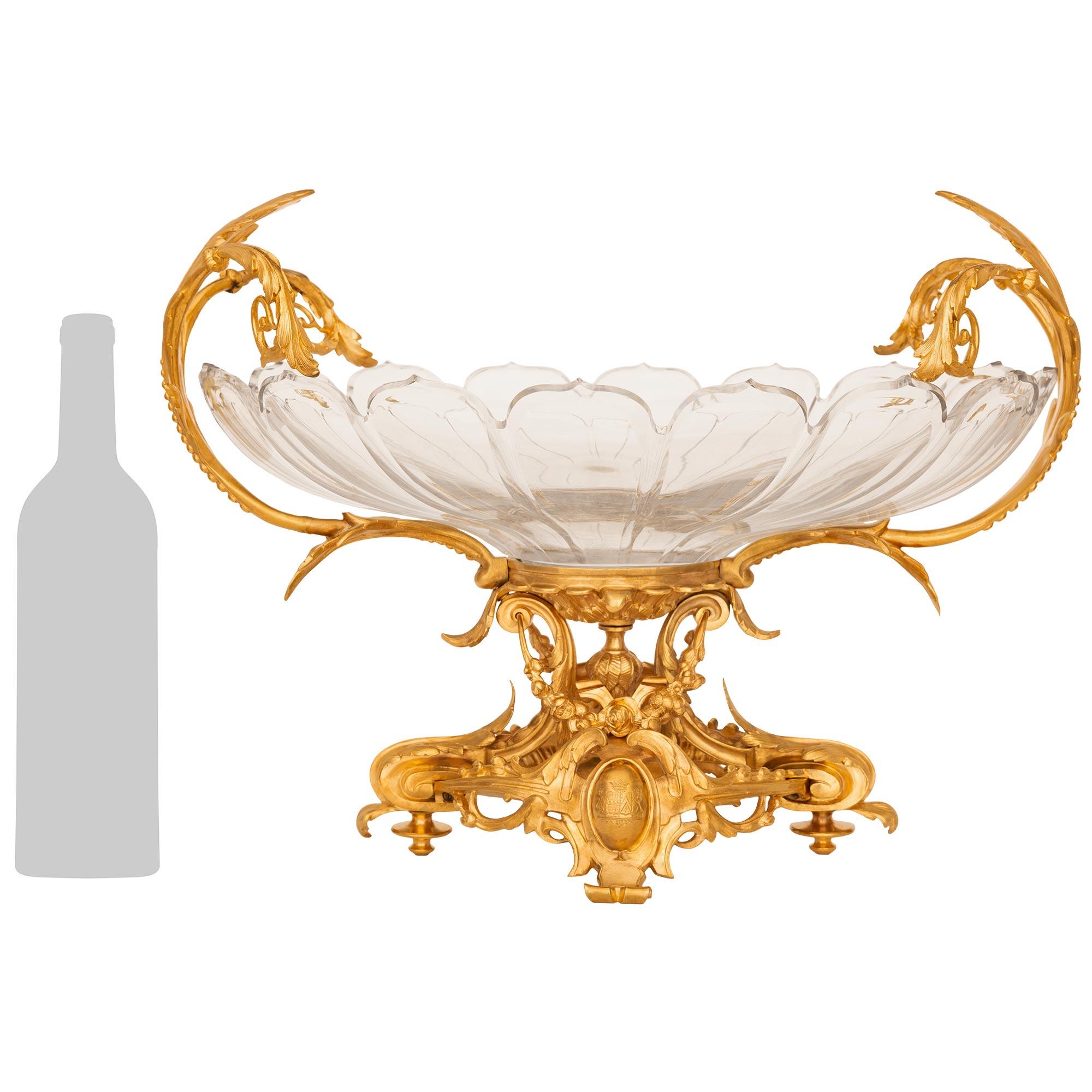 A stunning and high quality French 19th century Louis XV st. Baccarat Crystal and Ormolu centerpiece. This wonderful oval centerpiece is raised on a pierced Ormolu base decorated elegantly with scrolling foliate movements, swaging floral garlands