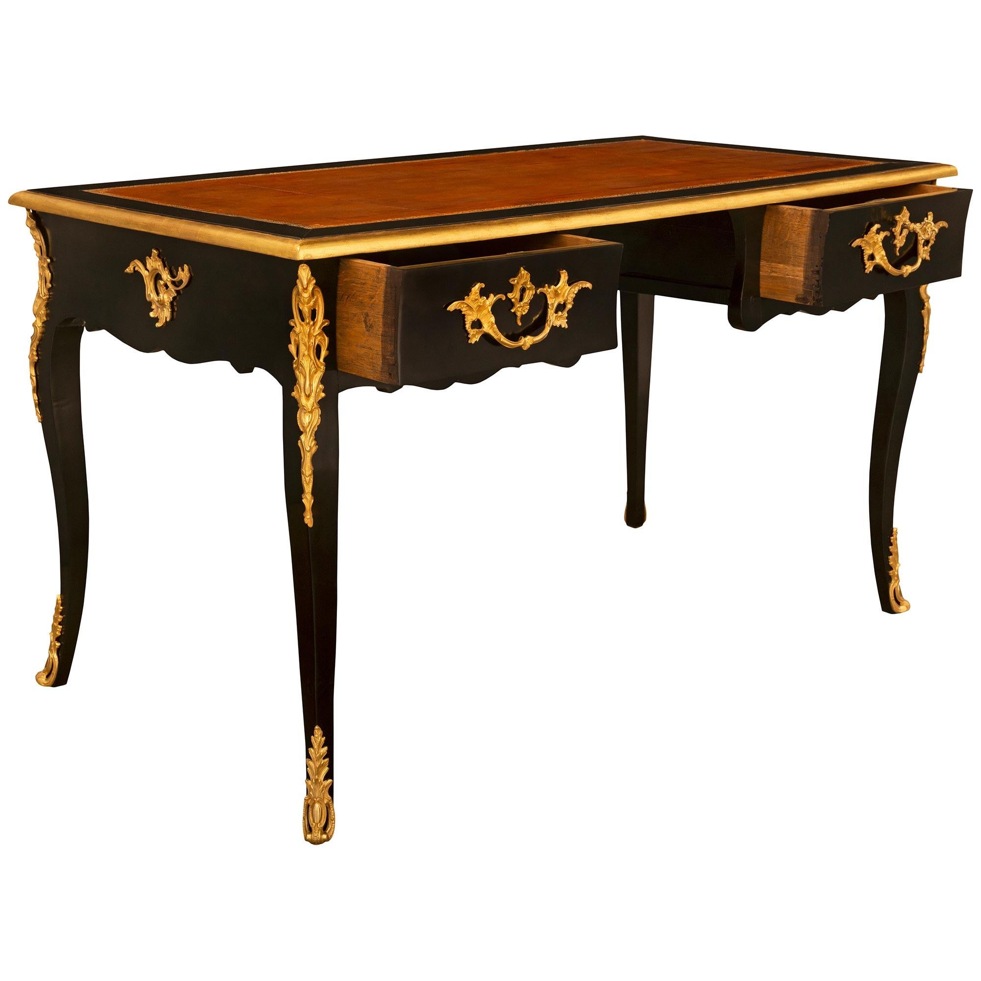 Leather French 19th Century Louis XV St. Ebonized Fruitwood And Ormolu Desk For Sale