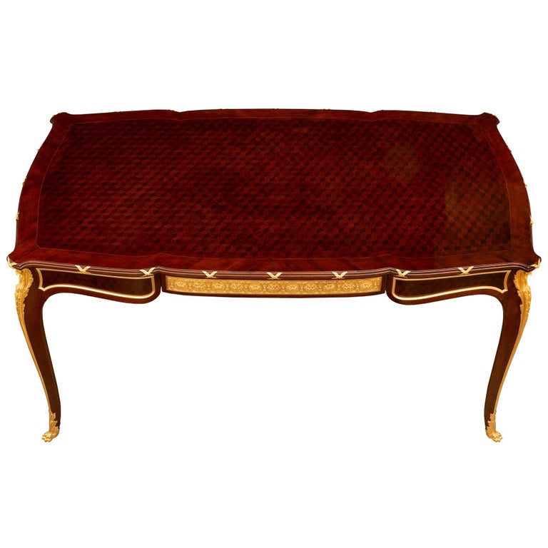 A stunning and most unique French 19th century Louis XV st. Belle Époque period Kingwood, Mahogany and ormolu desk signed by François Linke. The desk is raised by elegant cabriole legs with handsome paw feet with acanthus leaves and fine chutes