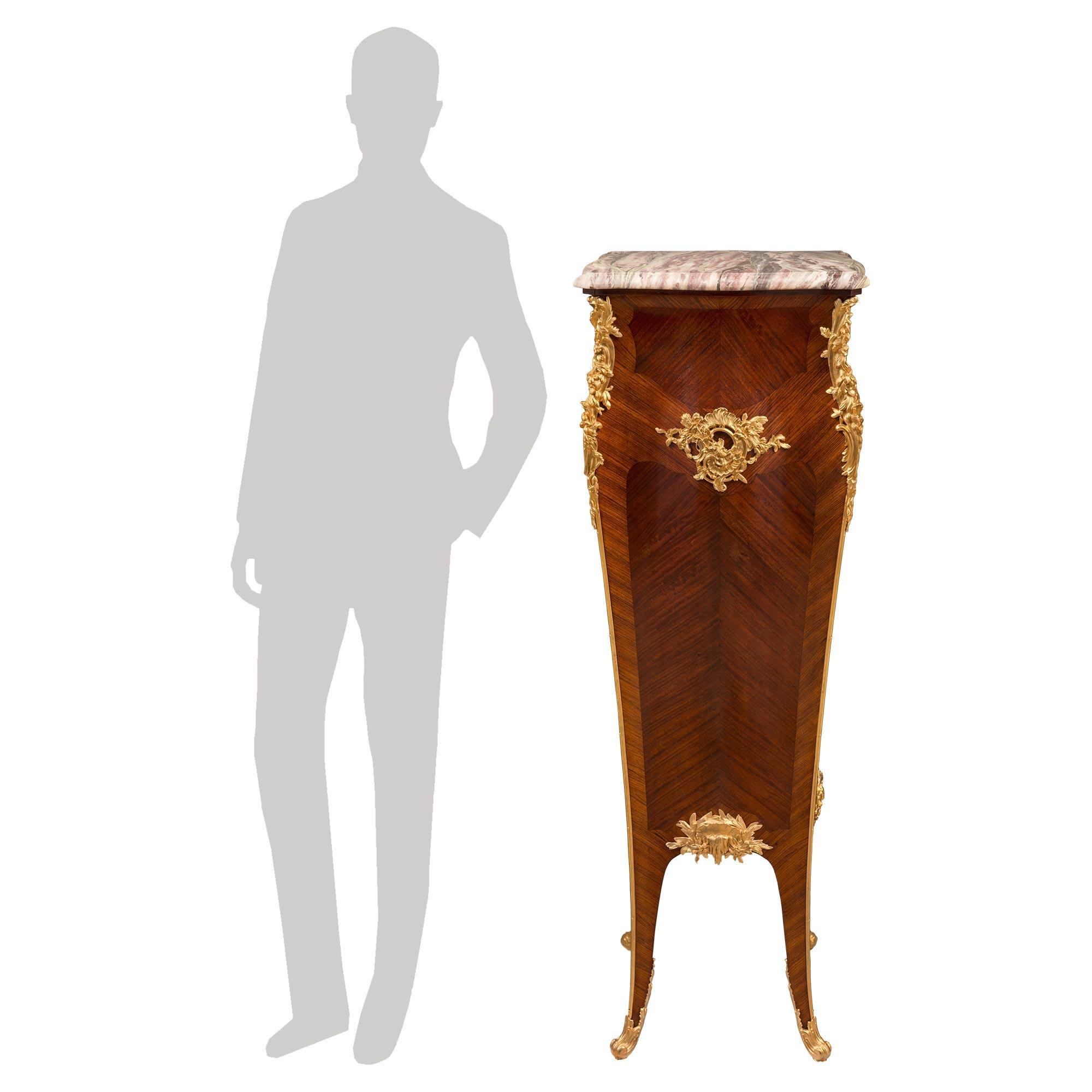 An impressive and most elegant French 19th century Louis XV st. kingwood, ormolu and Brèche Violette marble pedestal column, in the manner of François Linke. The pedestal is raised by beautiful lightly curved tapered legs with impressive finely