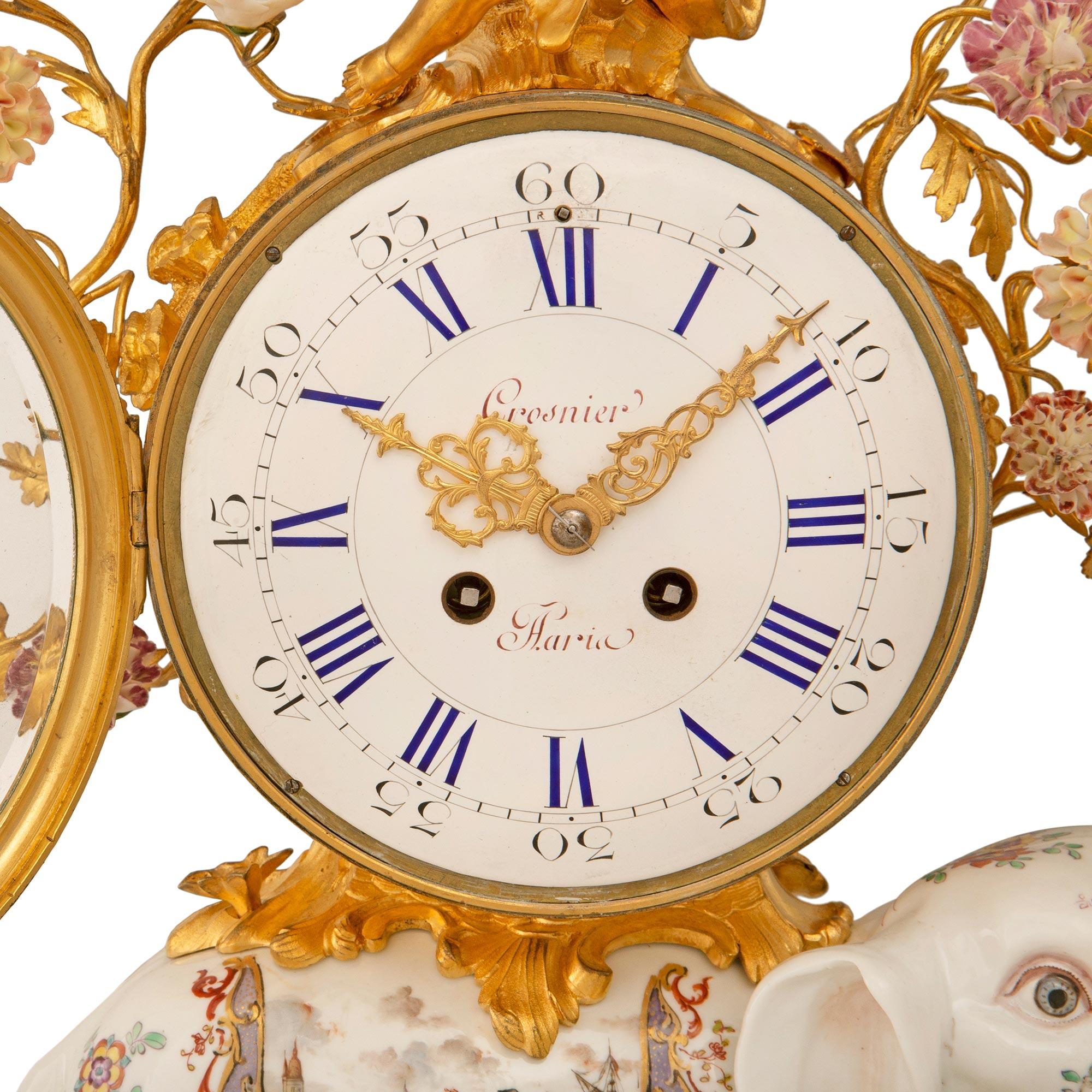 An exceptional and most decorative French 19th century Louis XV st. Meissen porcelain and ormolu clock signed Meissen and Crosnier. The clock is raised by a beautiful scrolled ground designed ormolu base with charming foliate designs in a striking