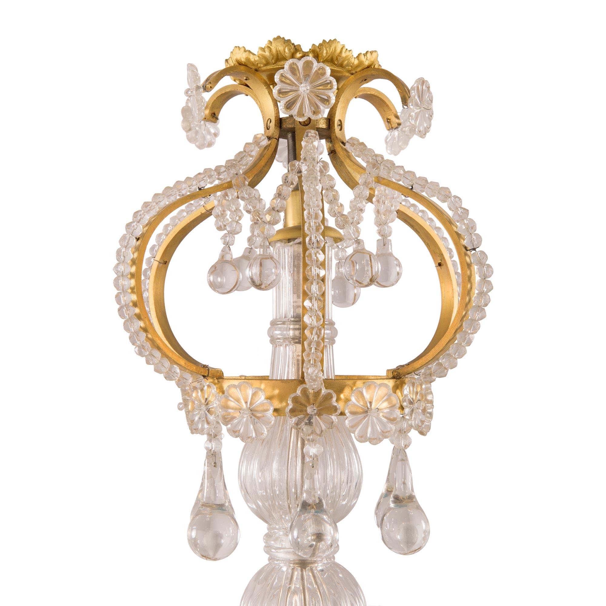 French 19th Century Louis XV St. Ormolu and Crystal Twelve-Light Chandelier In Good Condition For Sale In West Palm Beach, FL