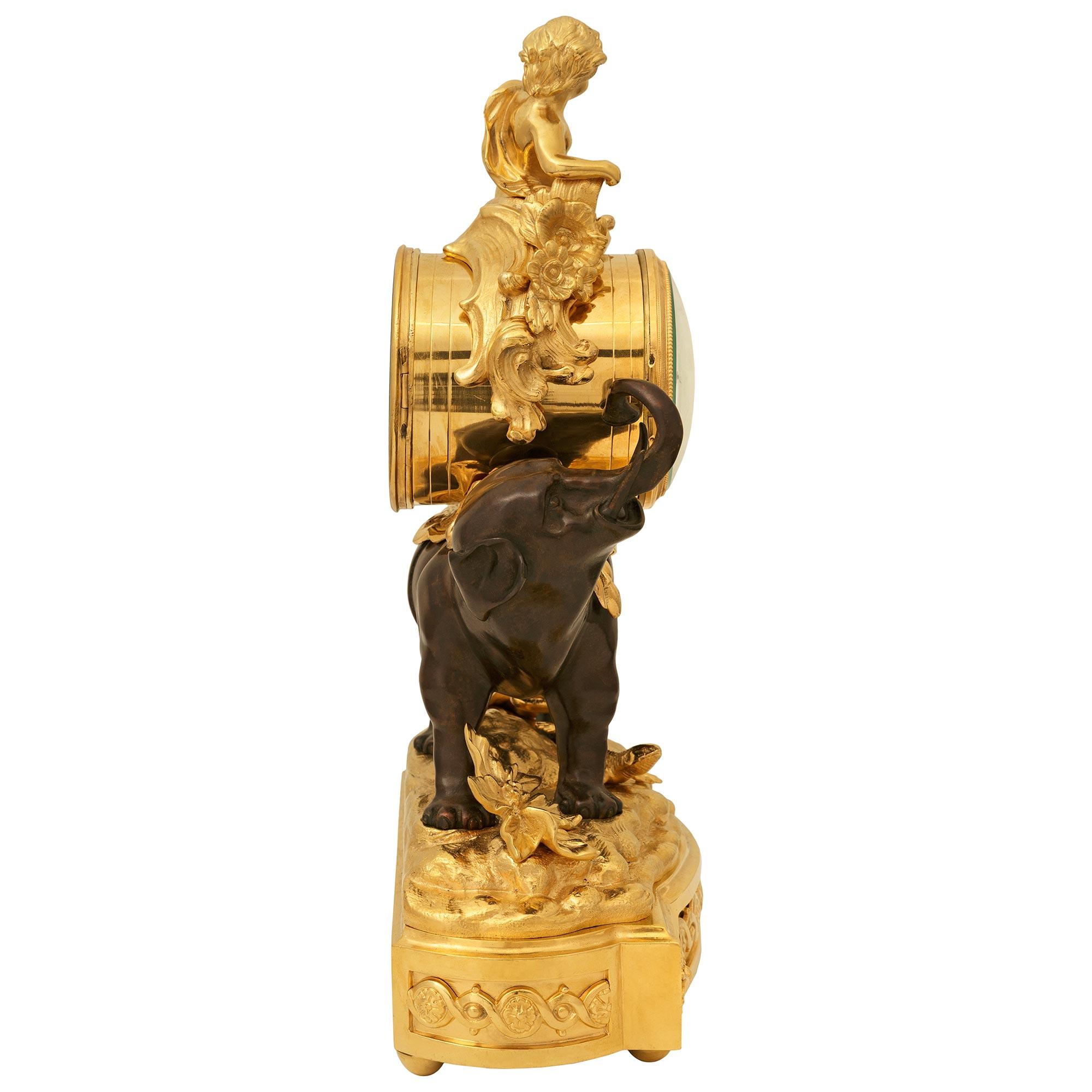 19th Century French 19th century Louis XV st. Ormolu and patinated Bronze clock For Sale