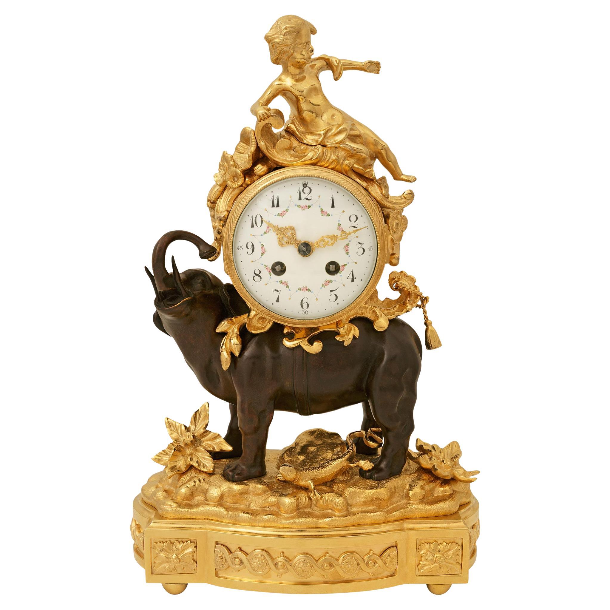 French 19th century Louis XV st. Ormolu and patinated Bronze clock