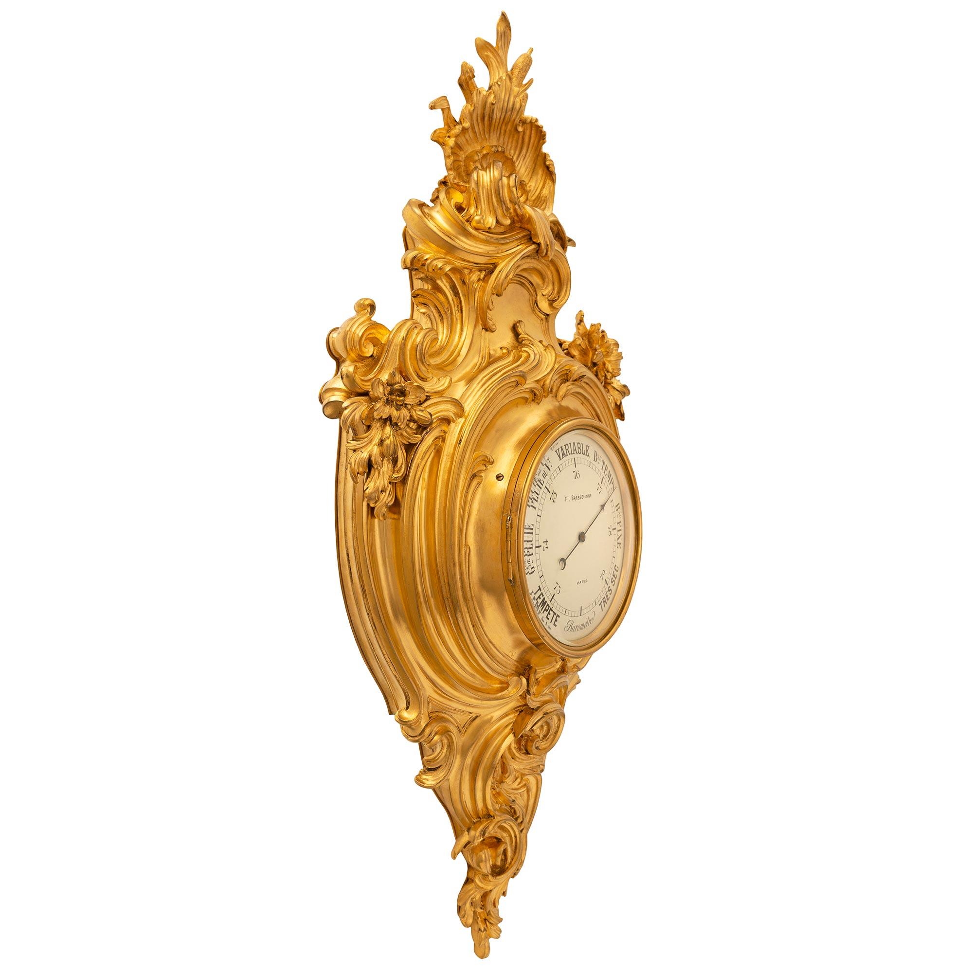 A stunning and extremely high quality French 19th century Louis XV st. ormolu wall mounted clock and barometer signed by Barbedienne. Each is set in an exquisite ormolu case with magnificent scrolled reeded foliate movements in a striking satin and