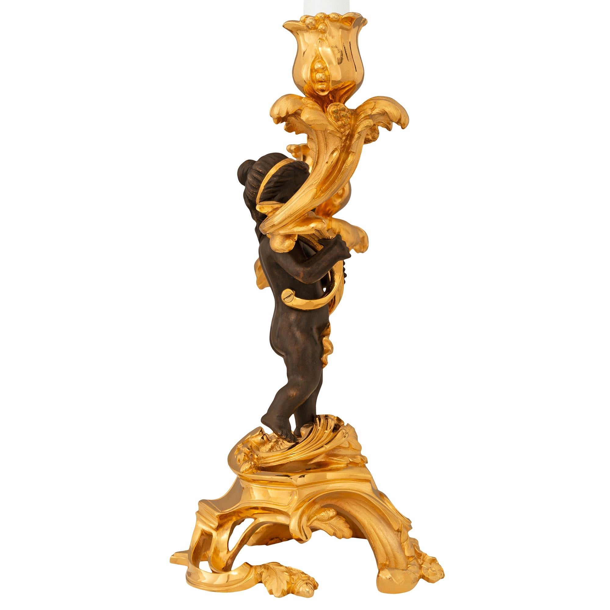 Patinated French 19th century Louis XV st. patinated Bronze and Ormolu candelabras For Sale