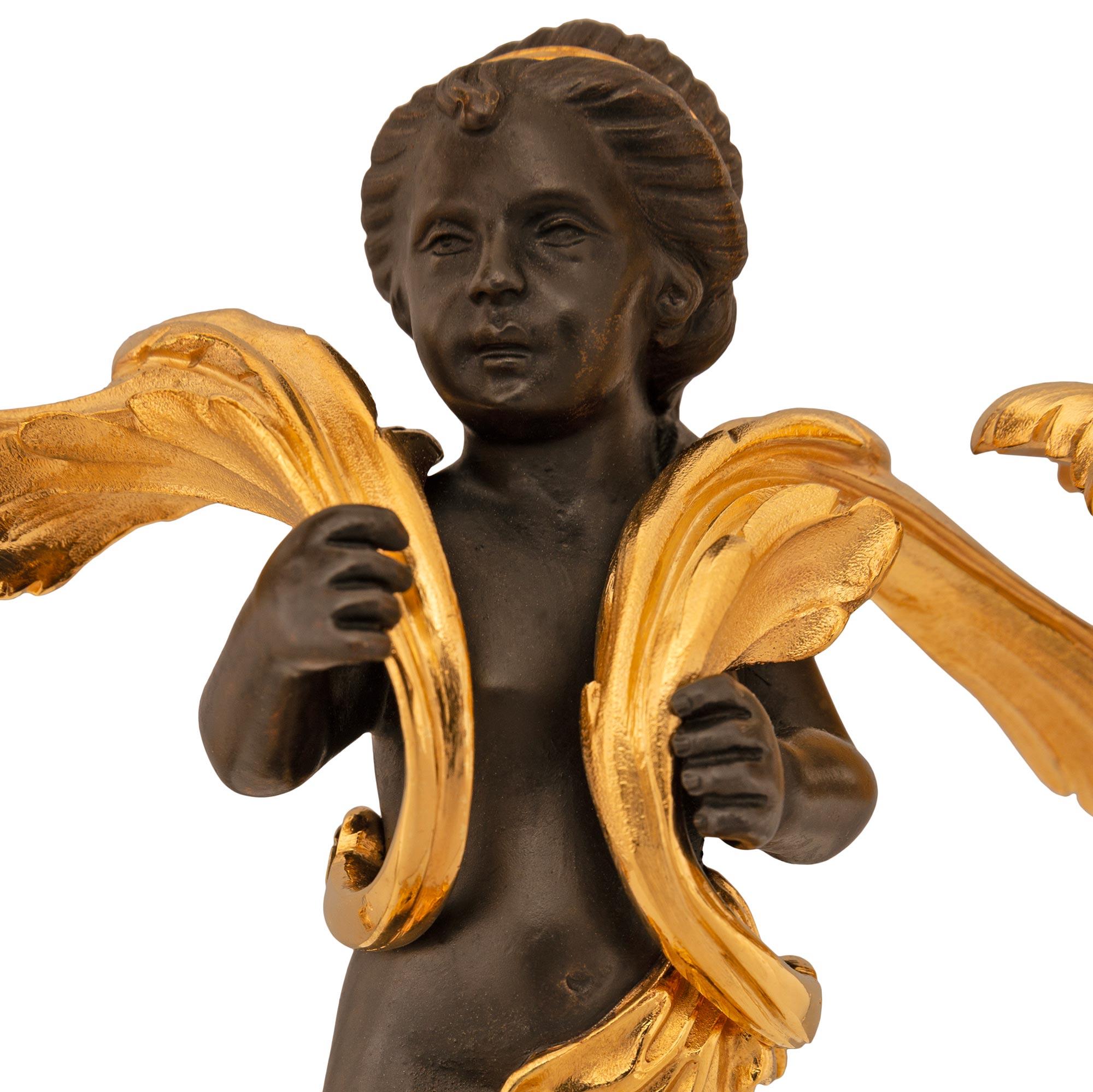 19th Century French 19th century Louis XV st. patinated Bronze and Ormolu candelabras For Sale