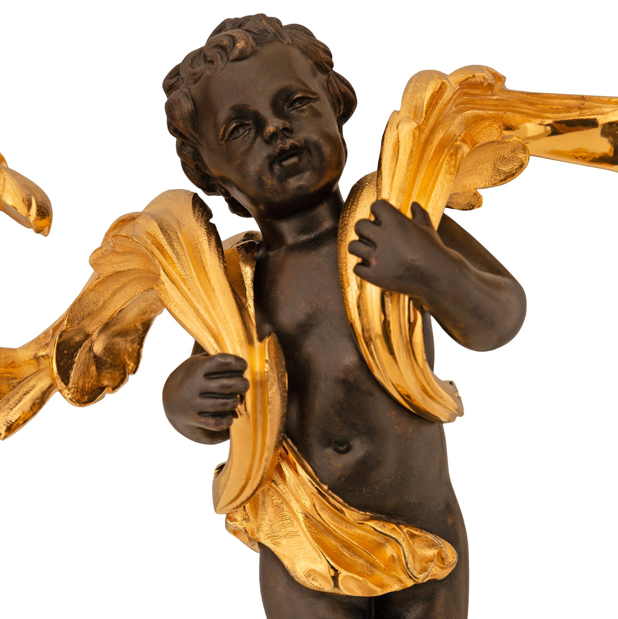 French 19th century Louis XV st. patinated Bronze and Ormolu candelabras For Sale 1