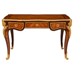 French 19th century Louis XV st. Tulipwood, Kingwood and Ormolu desk