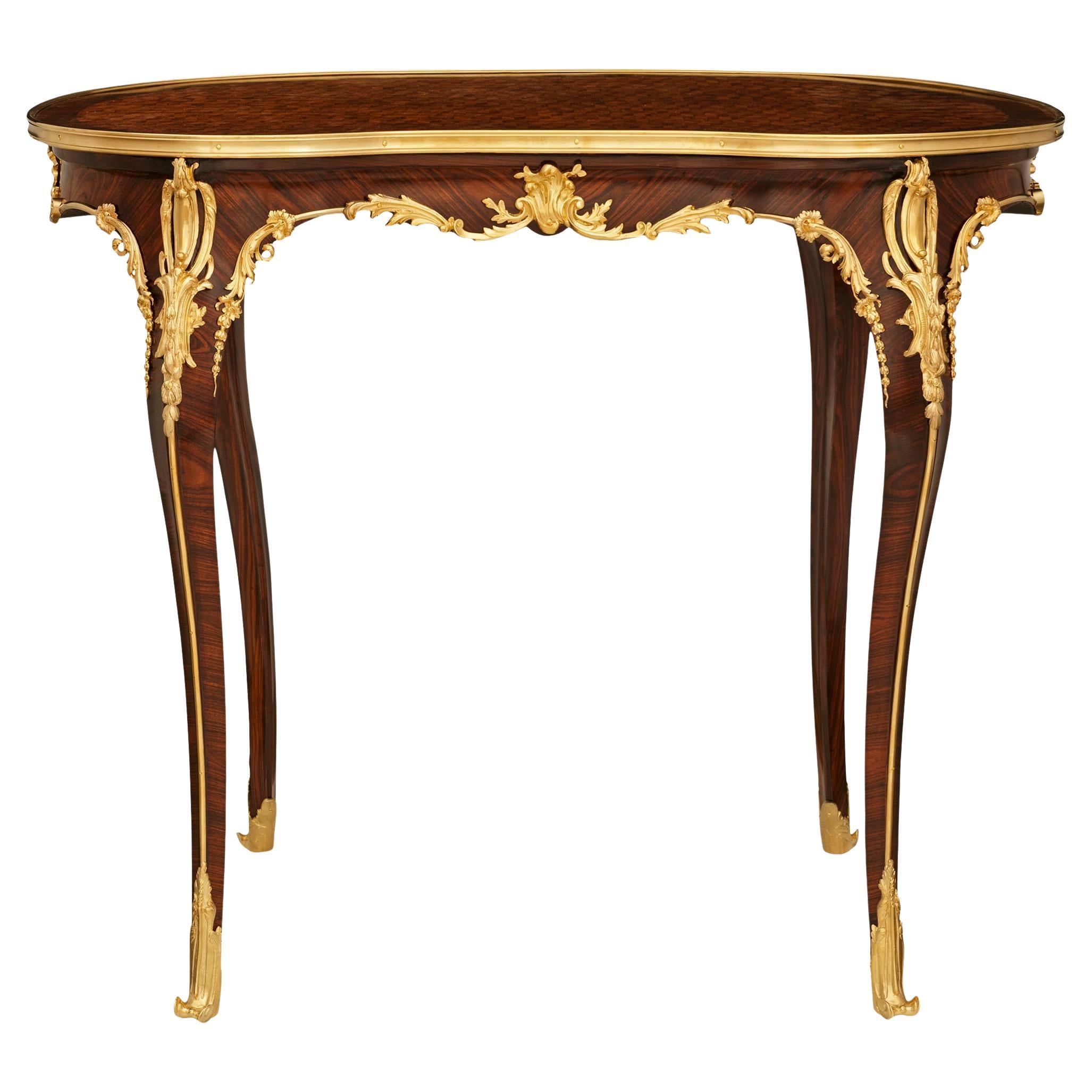 French 19th century Louis XV st. Tulipwood, Kingwood and Ormolu side table/desk