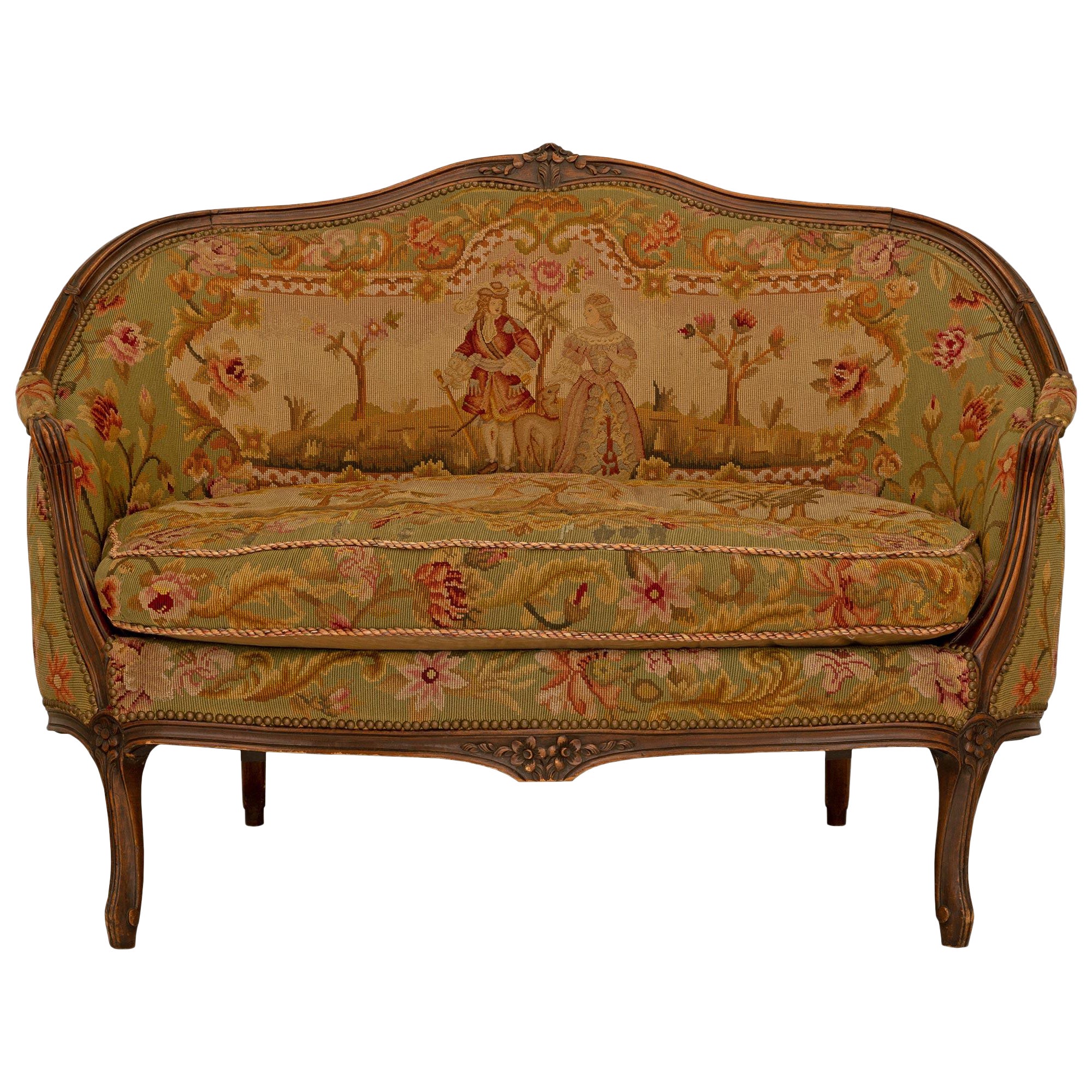 Sillón francés del siglo XIX Luis XV de nogal y tapicería