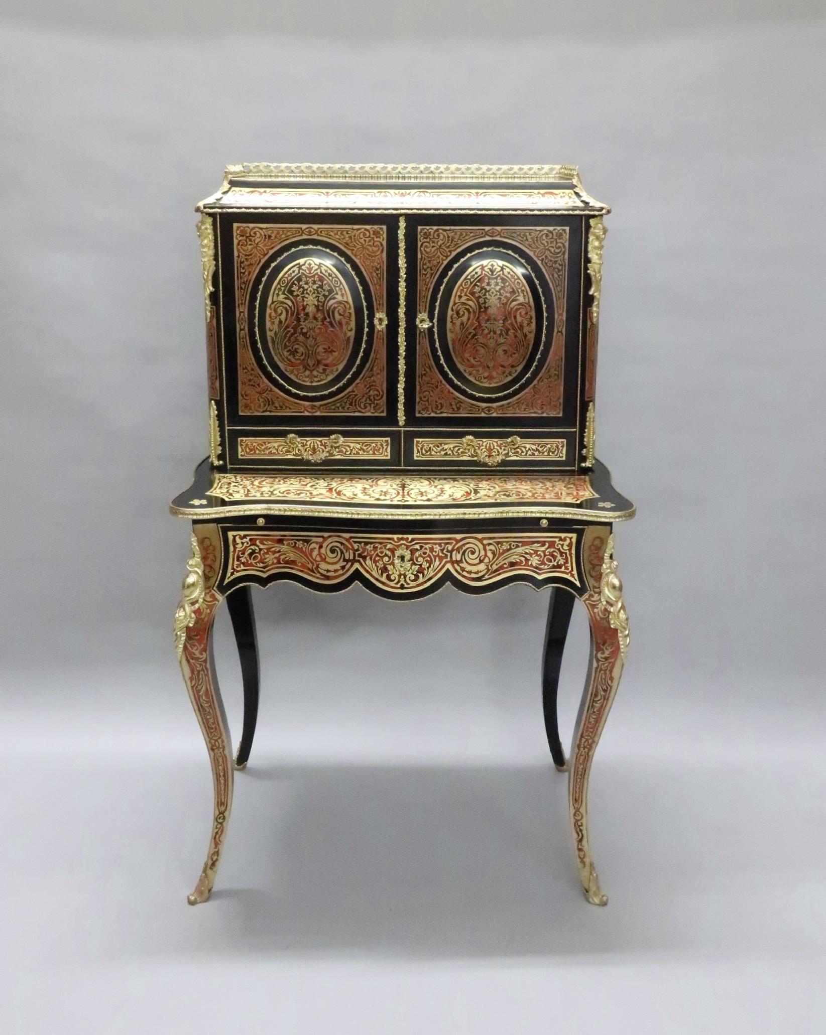 A fabulous quality French Louis XV style ebonized boulle red tortoiseshell and engraved brass Bonheur du jour writing cabinet with domed oval panels to the doors and serpentine shaped based with square tapering cabriole legs. There are two drawers