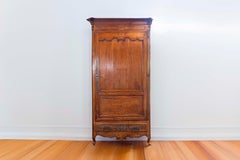 French 19th Century Louis XV Style Cherry Bonnetière with Intricate Hardware