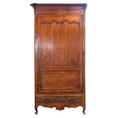 French 19th Century Louis XV Style Cherry Bonnetière with Intricate Hardware