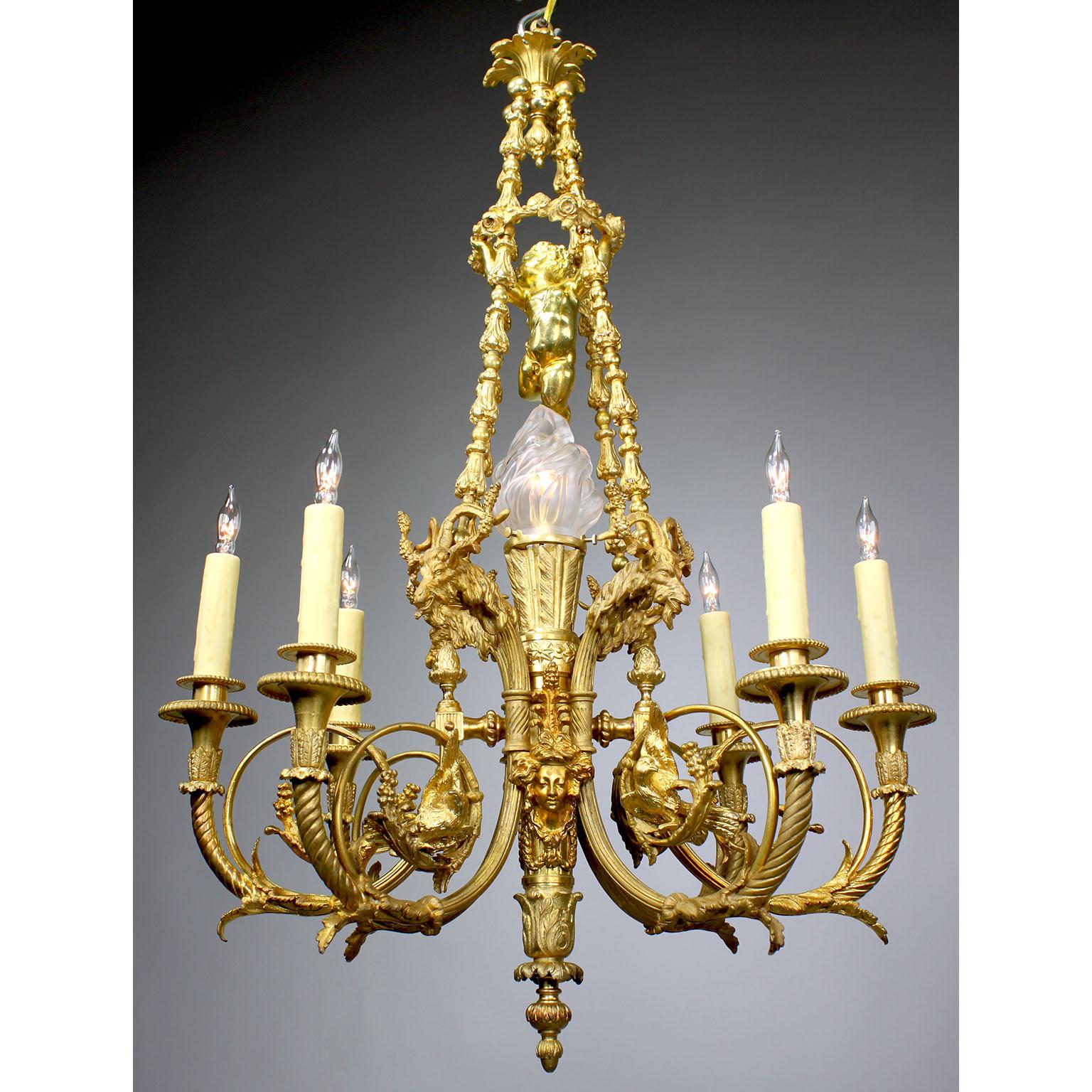 A fine French 19th Century Louis XV Style gilt bronze seven-light figural chandelier. The elongated and ovoid gilt-bronze frame with six scrolled candle-arms (now electrified) surmounted with doves, ram-heads, vines, rosettes, fruits and tassels,