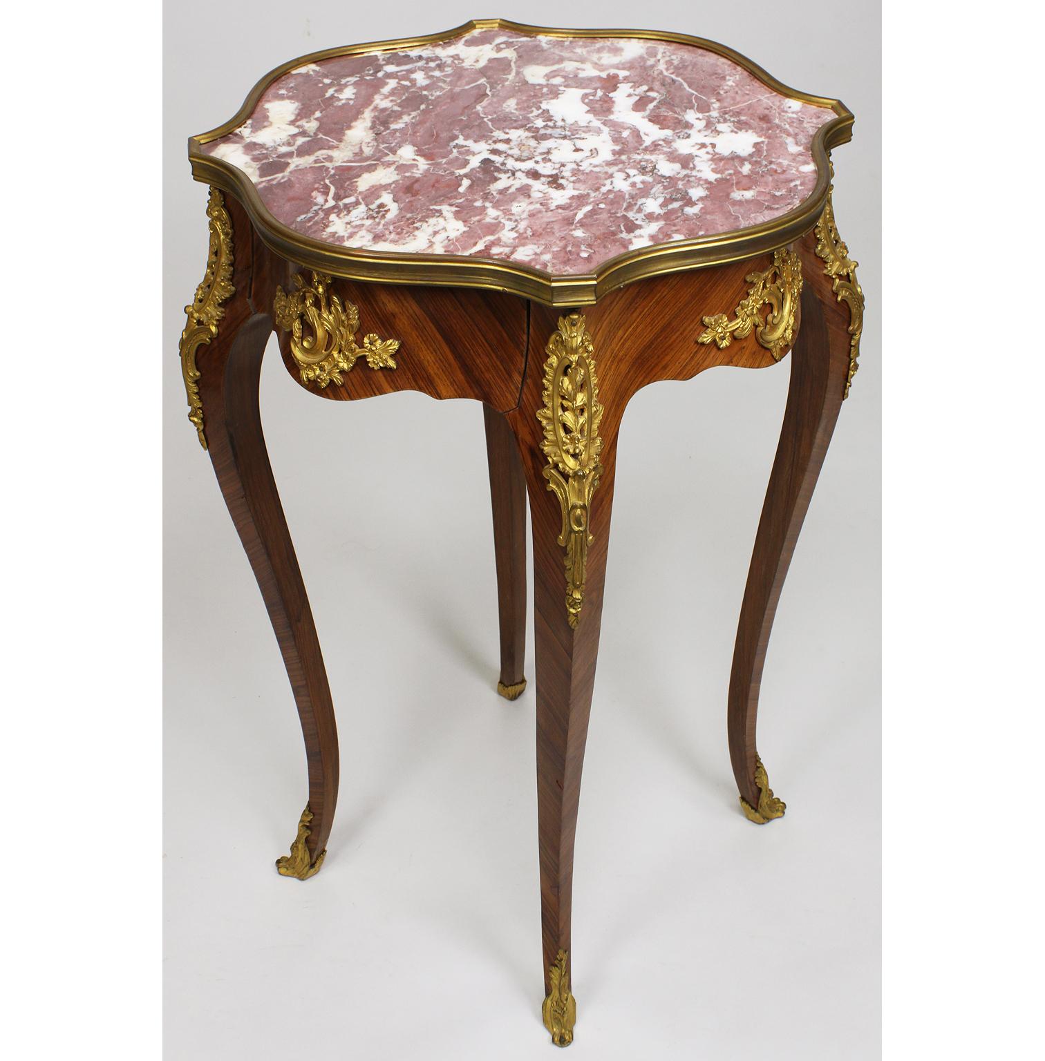 A very Fine French 19th century Louis XV style kingwood and ormolu-mounted marble top gueridon side table. The semi-circular single-drawer table fitted with a Rouge Royal marble top surmounted with a gilt bronze trim raised on four cabriolet legs