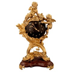 Antique French 19th Century Louis XV Style Ormolu Bronze and Rouge Griotte Marble Clock