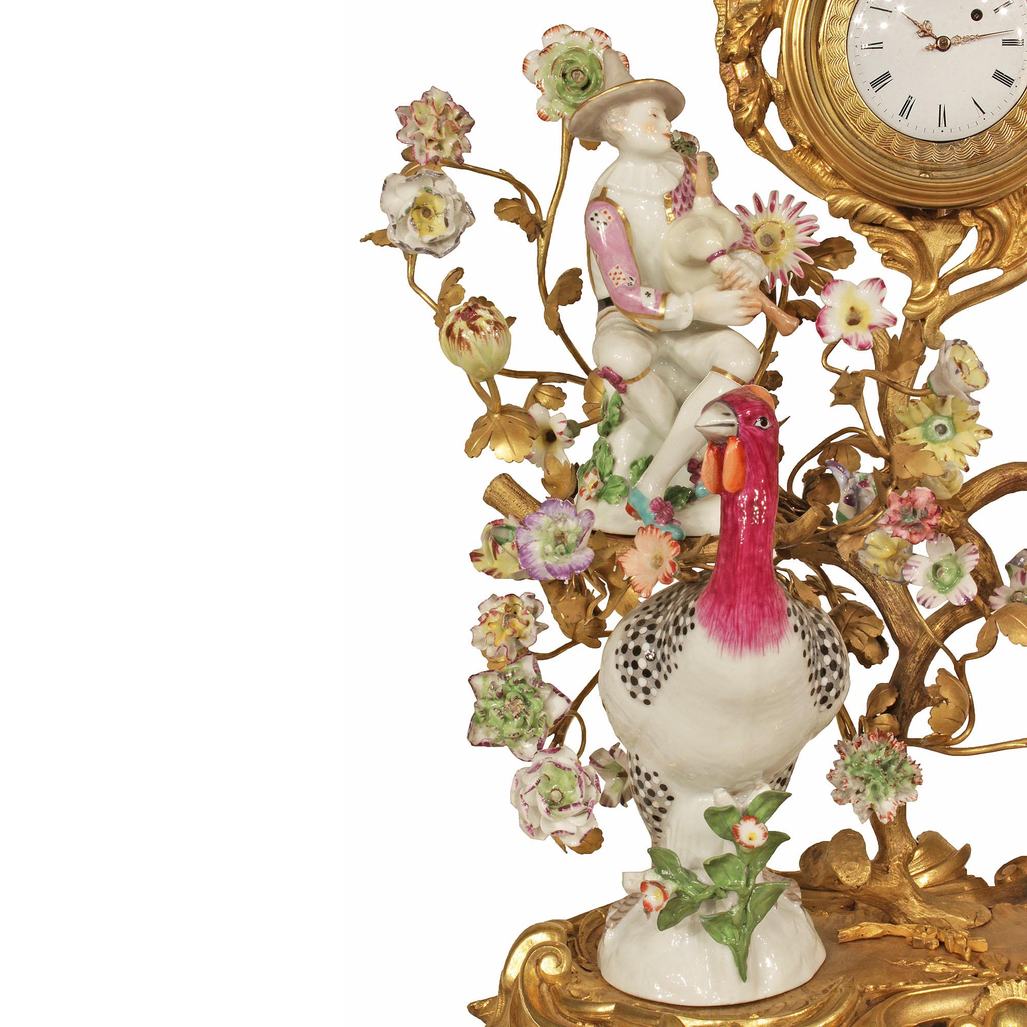 An attractive and high-quality French 19th century Louis XV style porcelain and ormolu clock signed Meissen. The clock is raised by a stunning pierced ormolu base with scrolled design and a handsome pair of guinea fowl. At the center is a scrolling