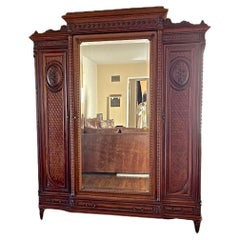 Used French 1950s Louis XV Style Stained Hand Carved Cherrywood Armoire