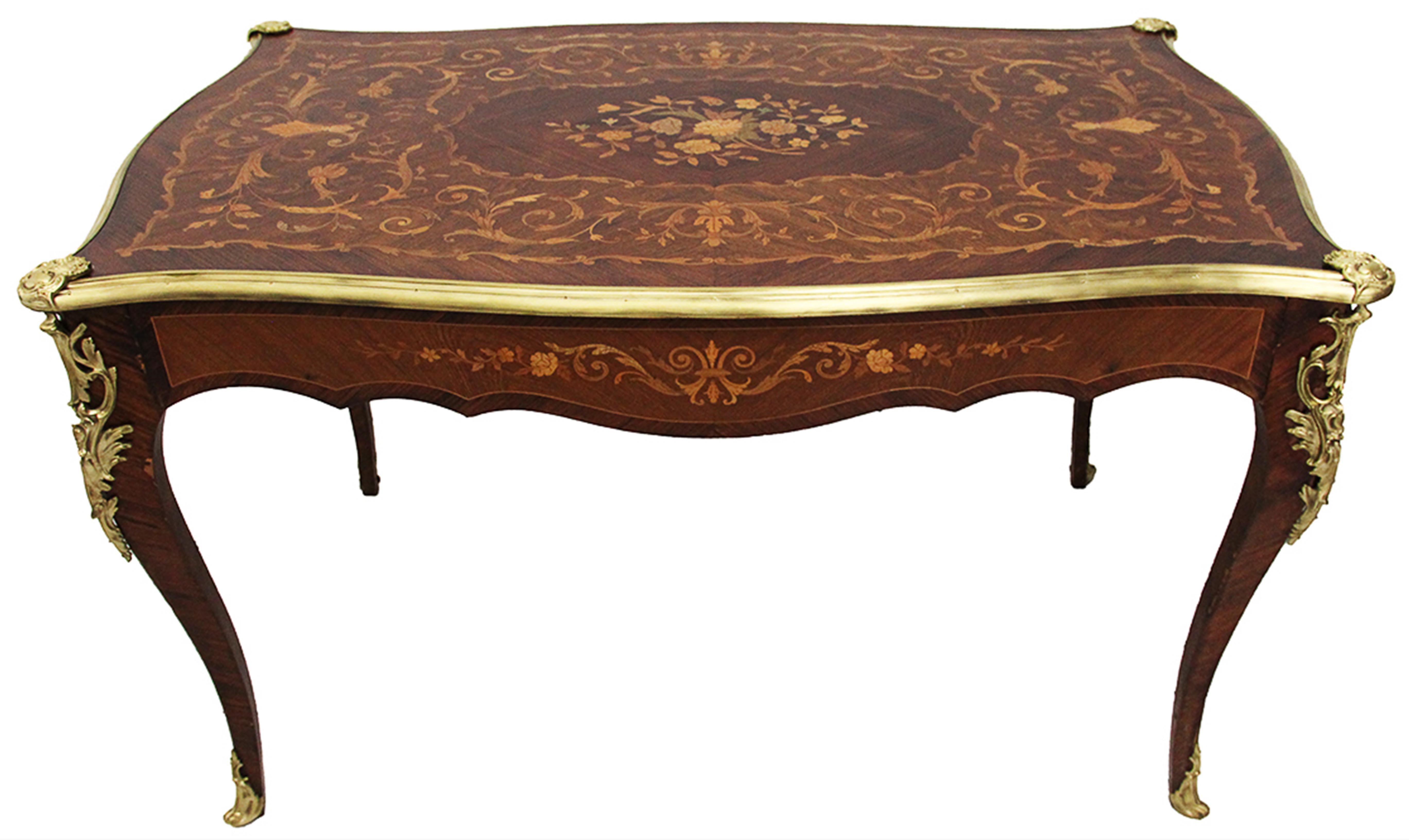 French 19th century Louis XV style table with flower marquetry and bronze framed
Violon-shaped writing table or desk, decorated with superb marquetry and Louis XV style bronzes.
French furniture of the 19th century, Louis XV style.
Dimensions