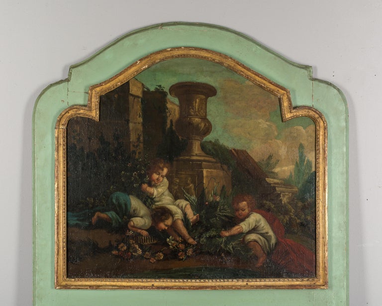 An early 19th century French Louis XV style trumeau mirror. Fine oil painting depicting a trio of cherubic children in a Classical garden setting. Pale green painted frame with giltwood decorative border trim. Original mirror with old silvering.