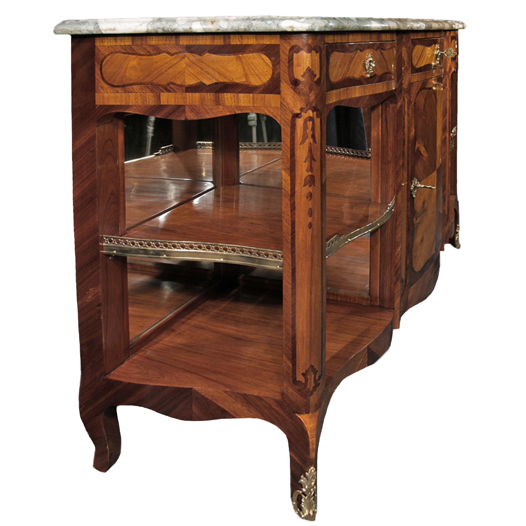 An elegant late 19th century French Louis XV st. tulipwood and kingwood buffet. The buffet is raised by cabriole legs and has an arbalest shaped front and bombee shaped sides. The scalloped shaped apron is below a central drawer with a quarter