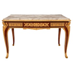 Bureau français du XIXe siècle de style Louis XV/XVI en acajou, bronze doré et marbre.