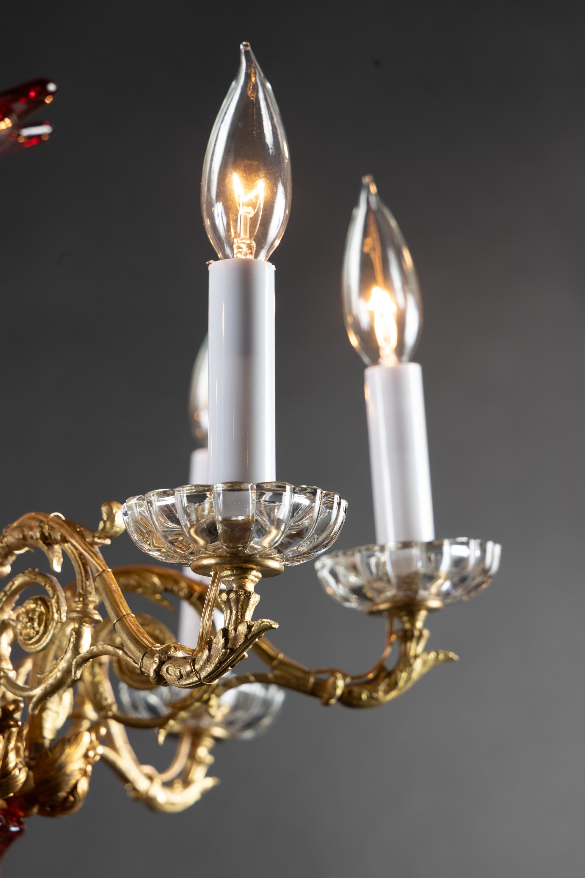 This beautiful French 19th century chandelier is made of bronze d’ore and features fantastic Baccarat crystal. The piece plays host to seven detailed arms with fine baccarat crystal bobeches. The center is made of magnificent baccarat crystal, which