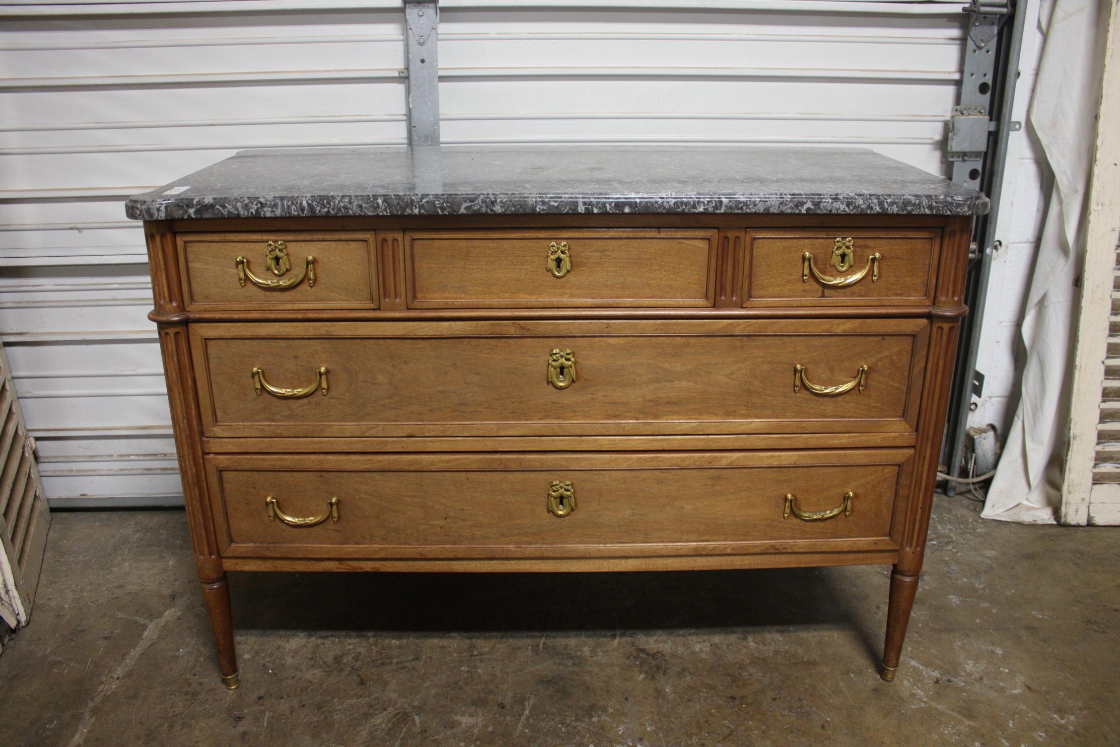 This Louis XVI chest is made of mahogany with beautiful bronze hardware. The marble is a Sainte-Anne marble top. The feet are covered with bronze hoofs.
Very elegant.