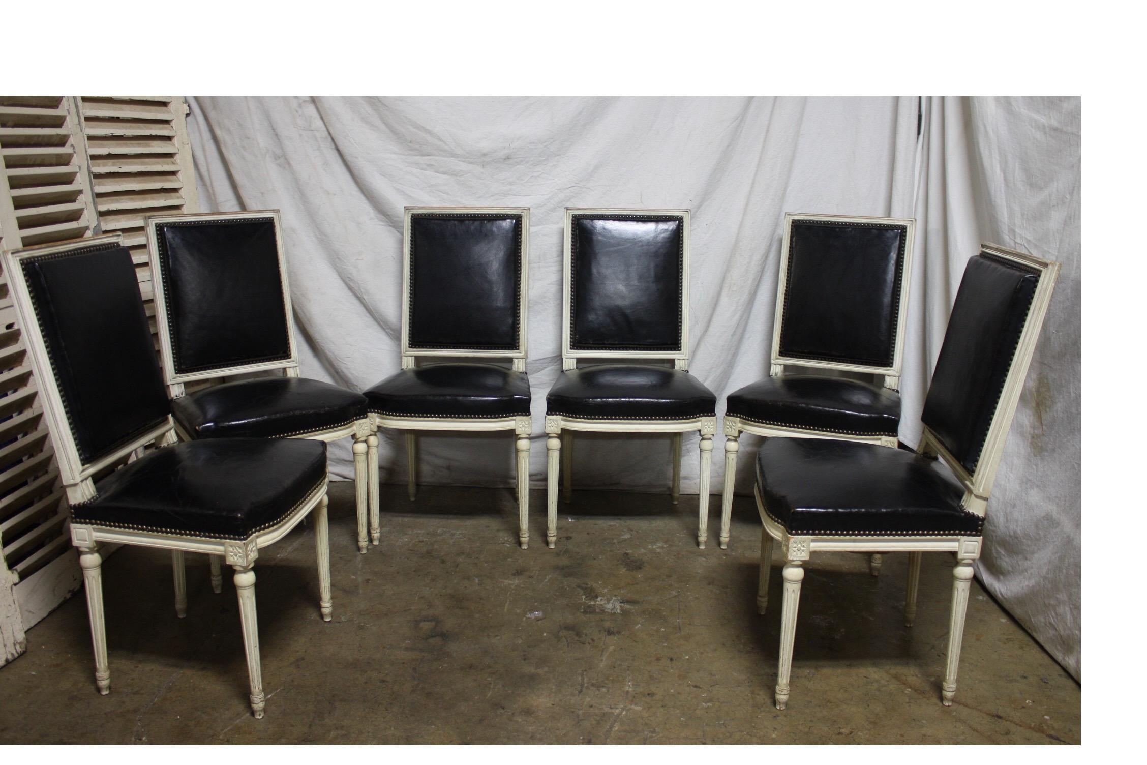 Beautiful set of French 19th Century Louis XVI dining chairs. Original paint and covered of black leather.